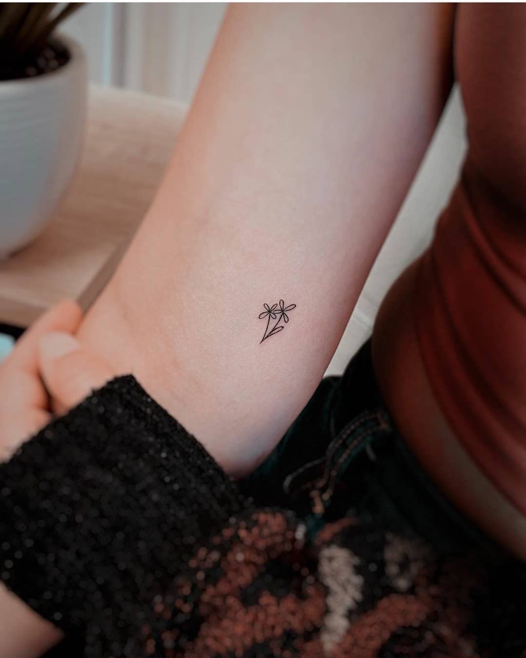 Tiny Single Ink Black Wildflower Tattoo Design