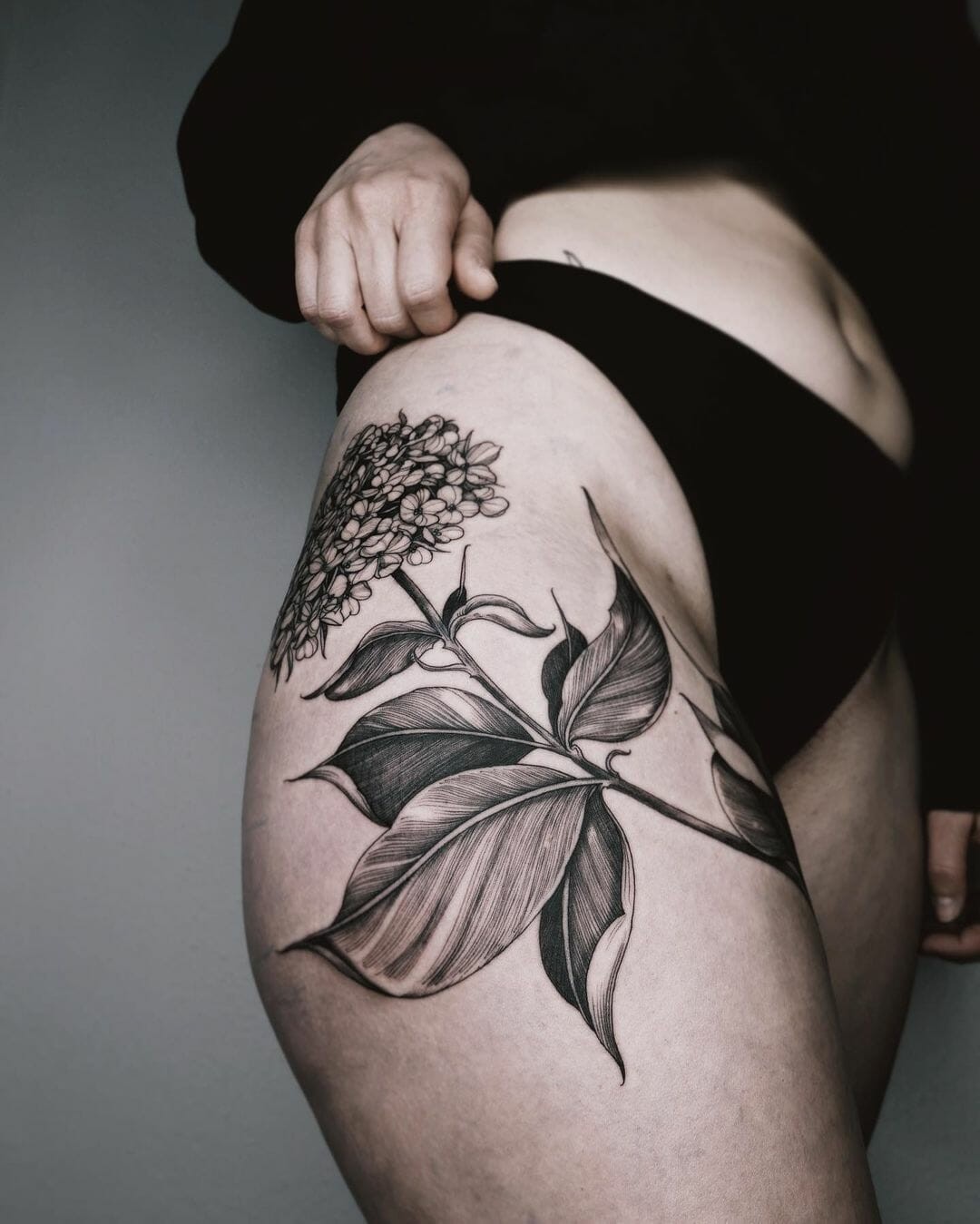 Black And White Thigh Tattoo