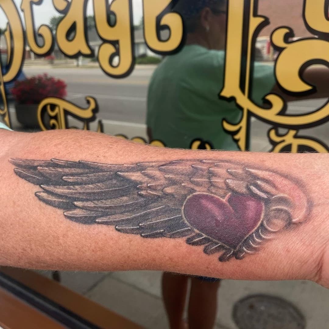 Folded Angel Wings And Heart Tattoo