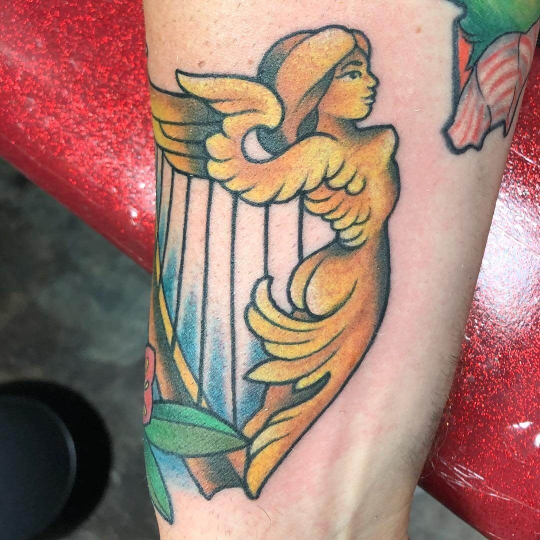 Stunning Beautiful Female Irish Harp tattoo