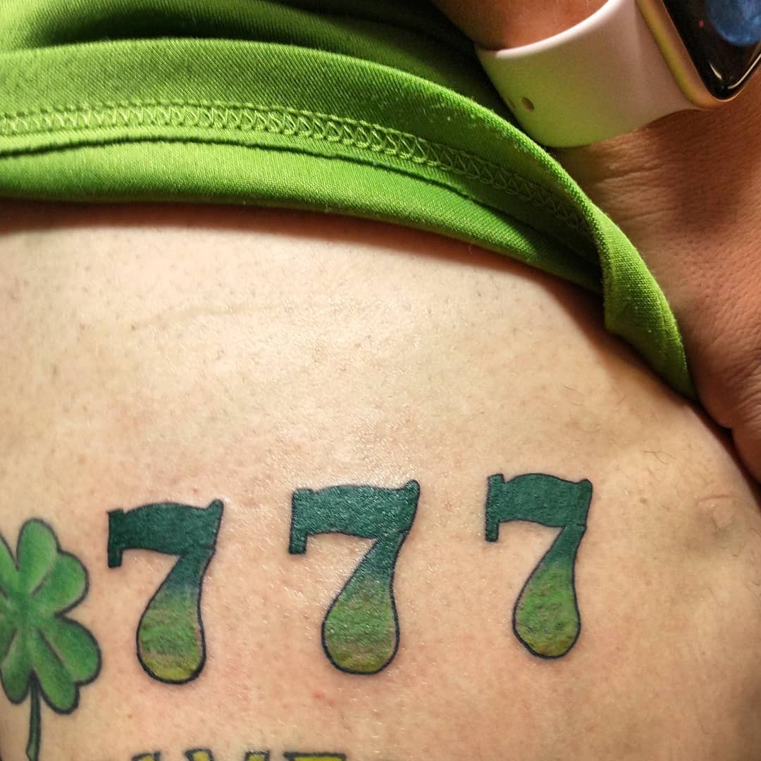 777 Tattoo With 4 Leaf Clover