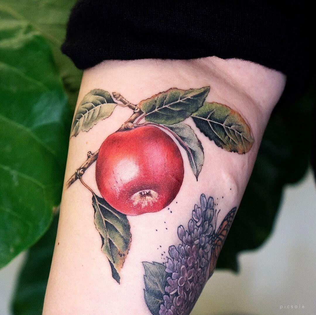 Tattoos Of Red Apples To Symbolize Venus