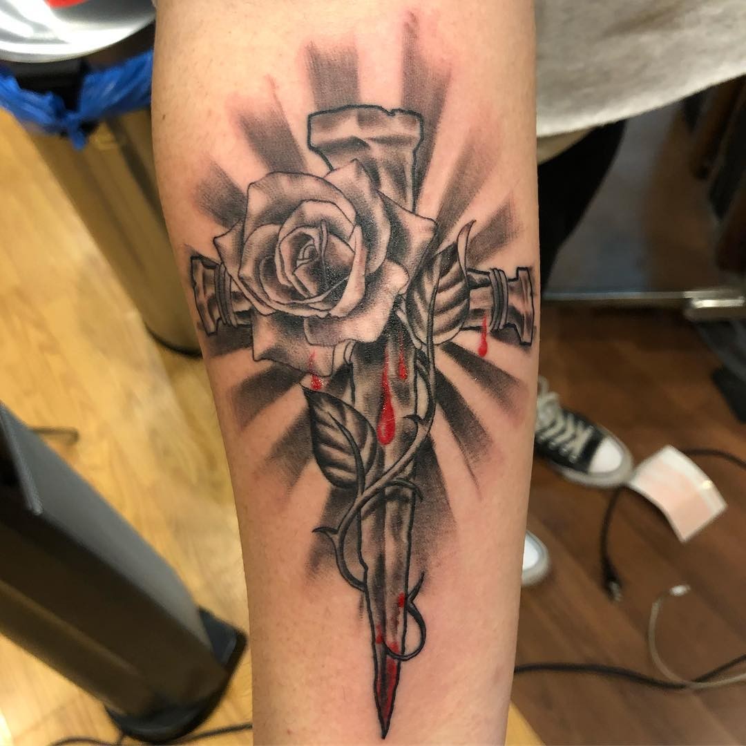 Floral-Themed Dripping Blood Nail Cross Tattoo Design