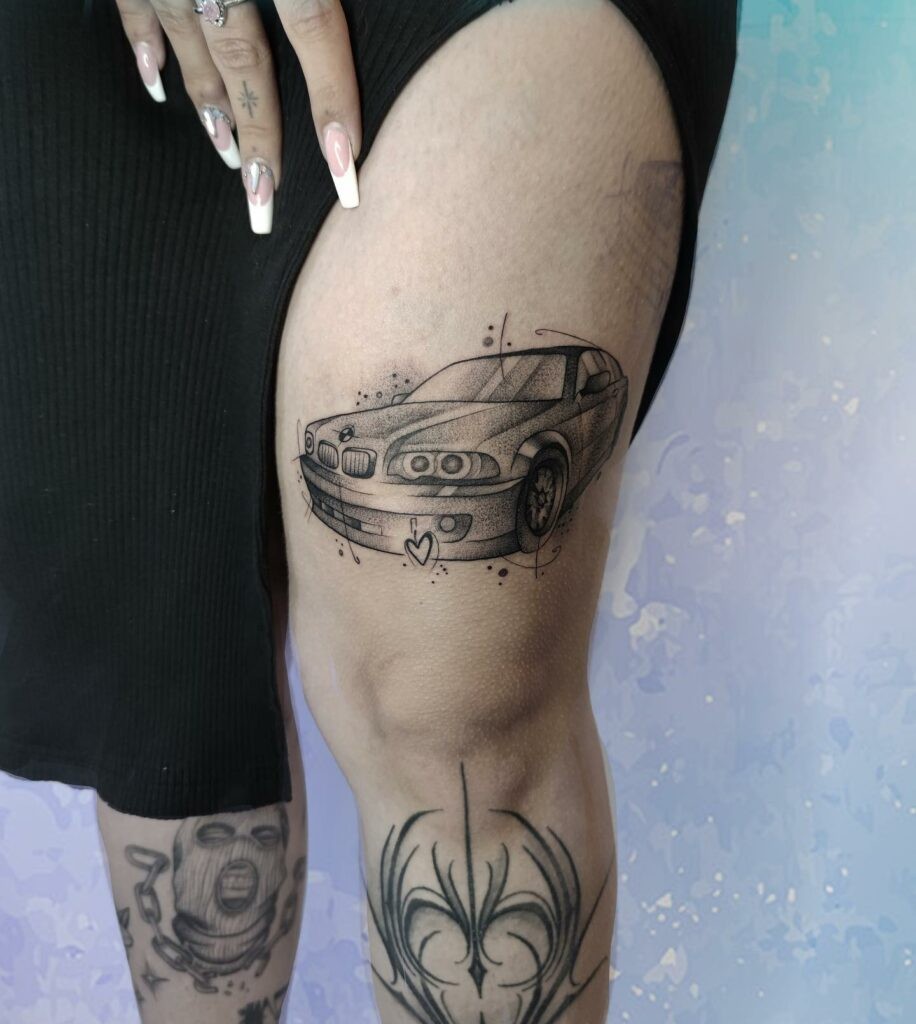 Black and Grey Alien BMW Car Tattoo On The Leg