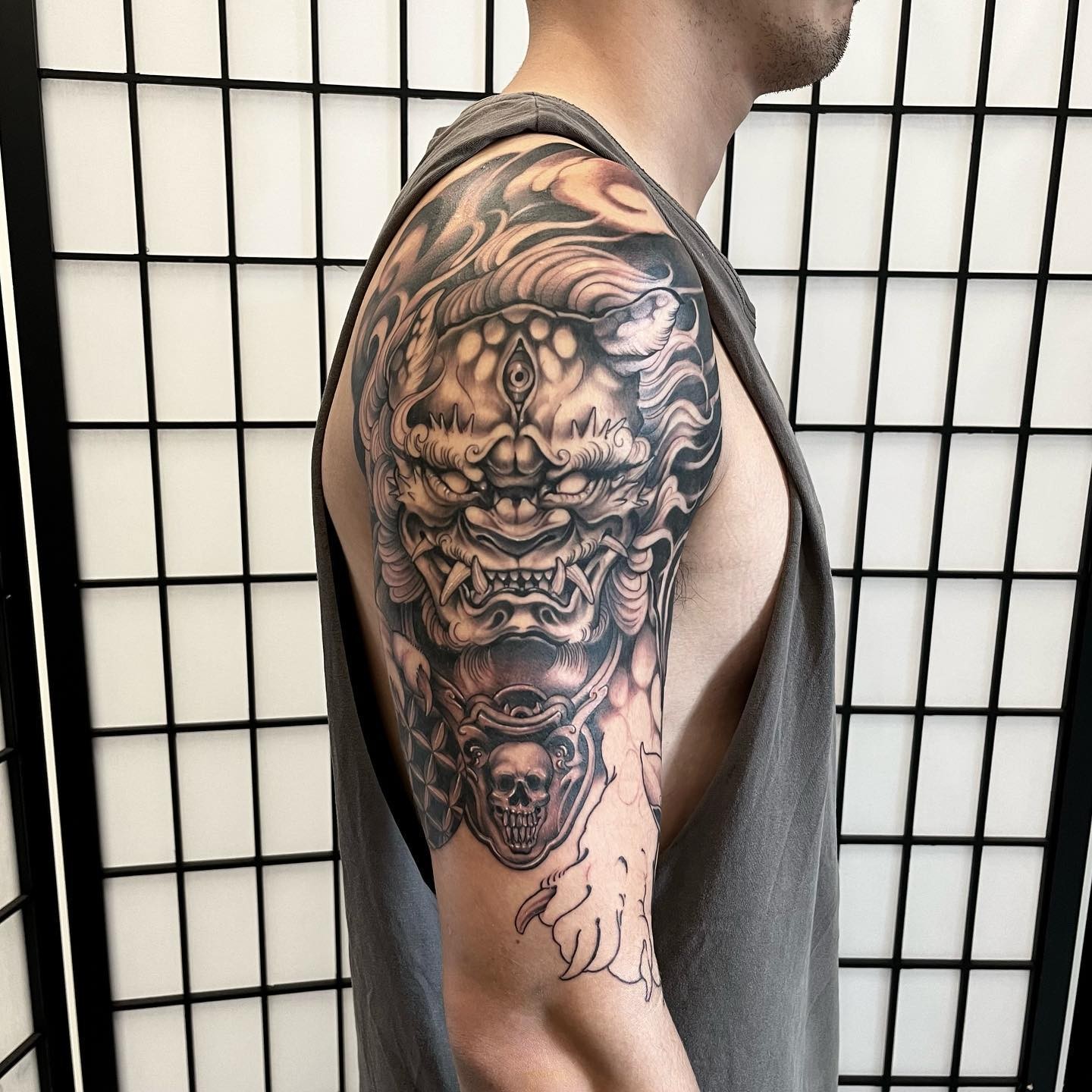 Amazing Black and Grey Male Foo Dog Tattoos