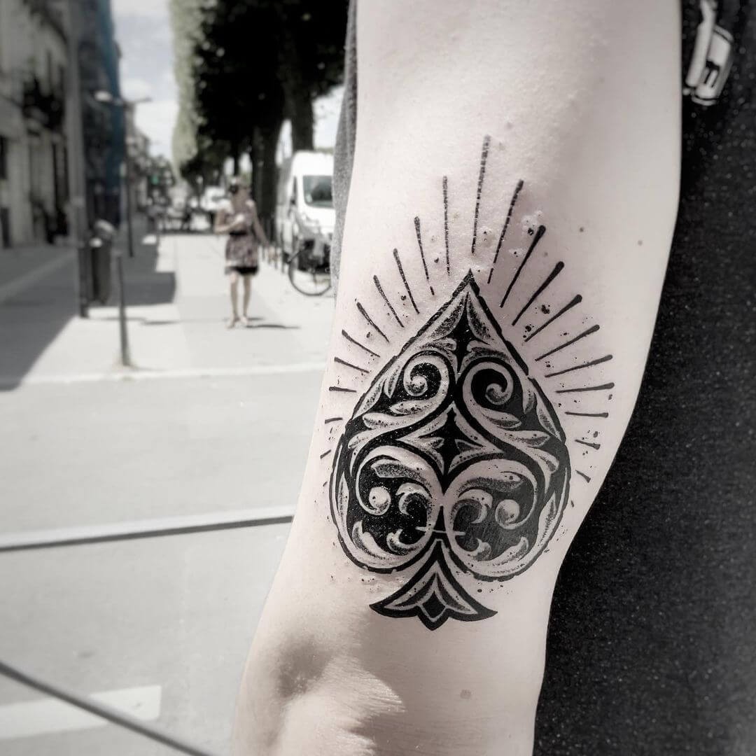 Spade Tattoo With Feminine Design