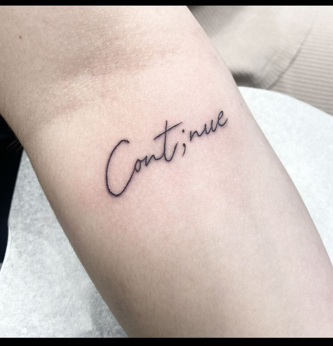 Continue Tattoo In Cursive Font