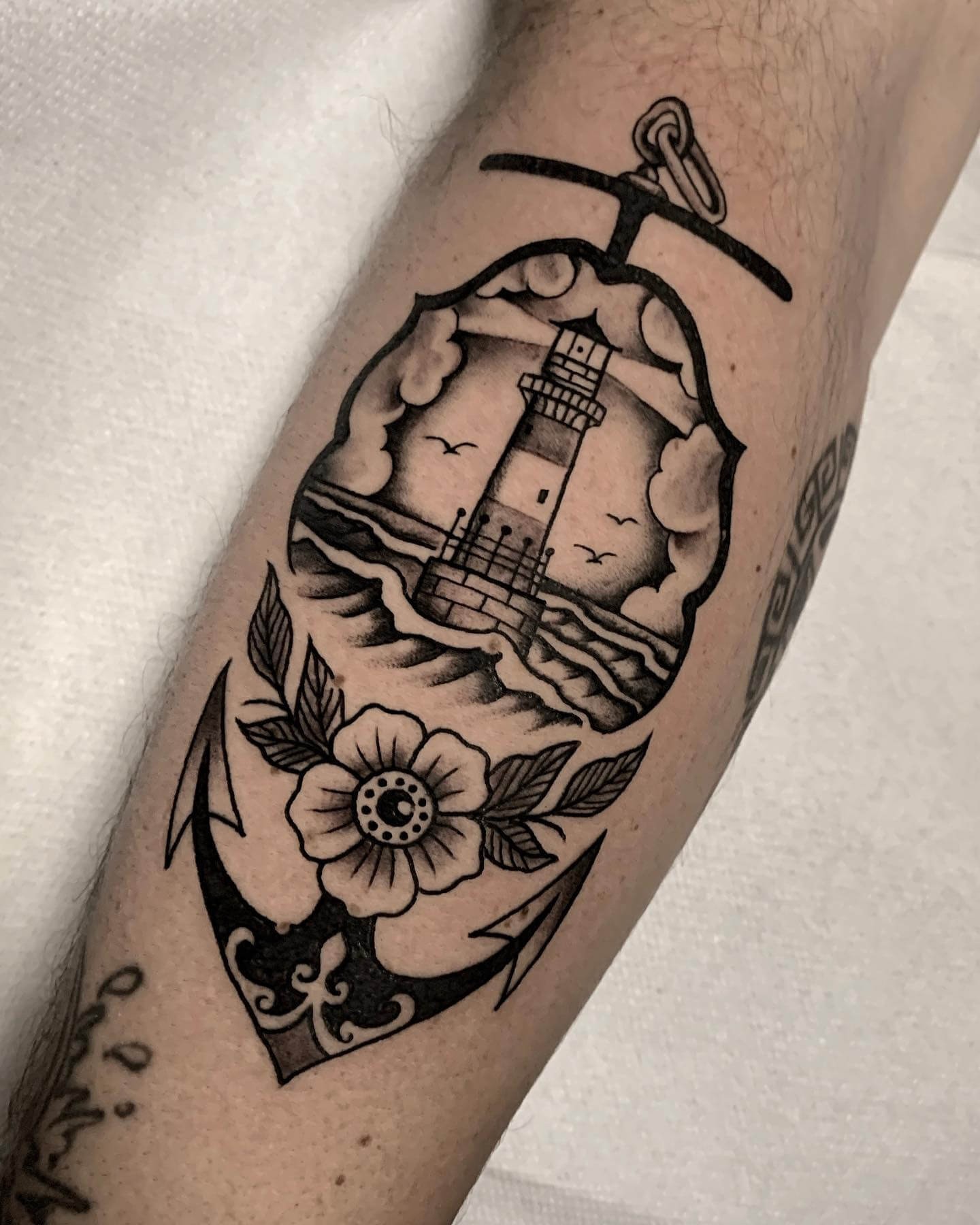 Artsy Black American Traditional Lighthouse Tattoo