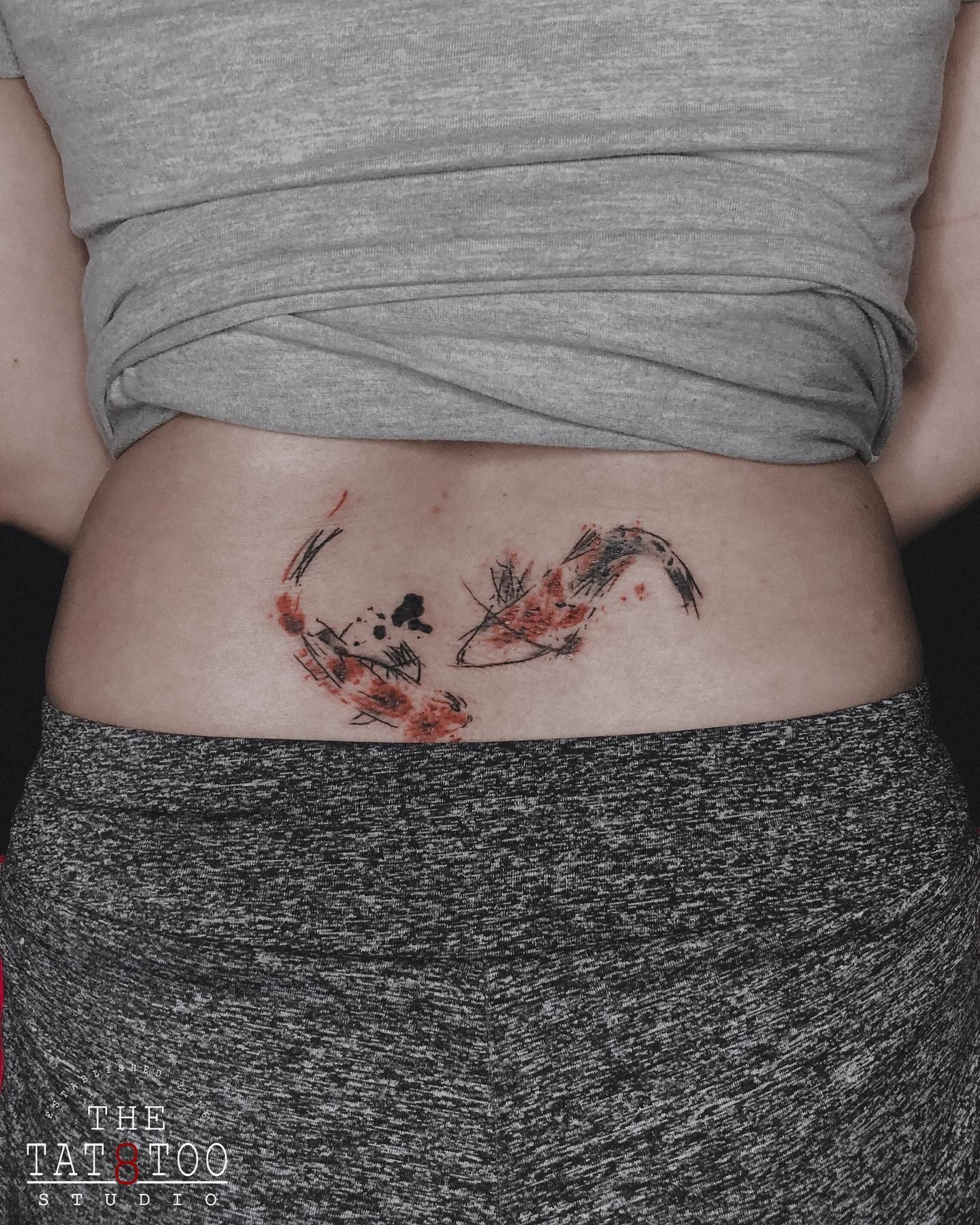 Koi Fish Lower Back Tattoo