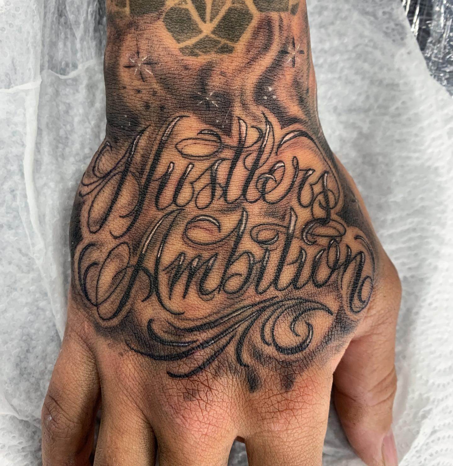 The “Hustler Ambition” Tattoo