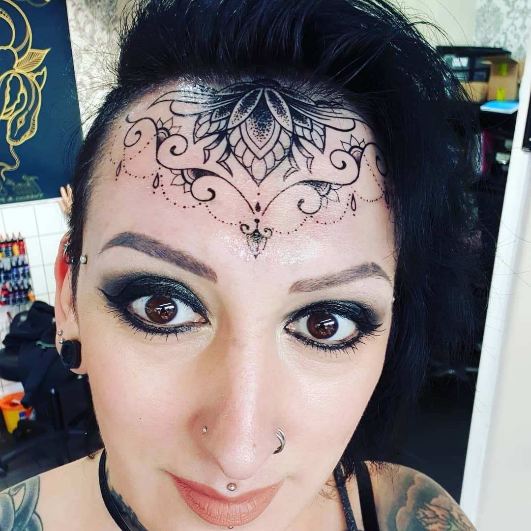 Ornamental Forehead Tattoo