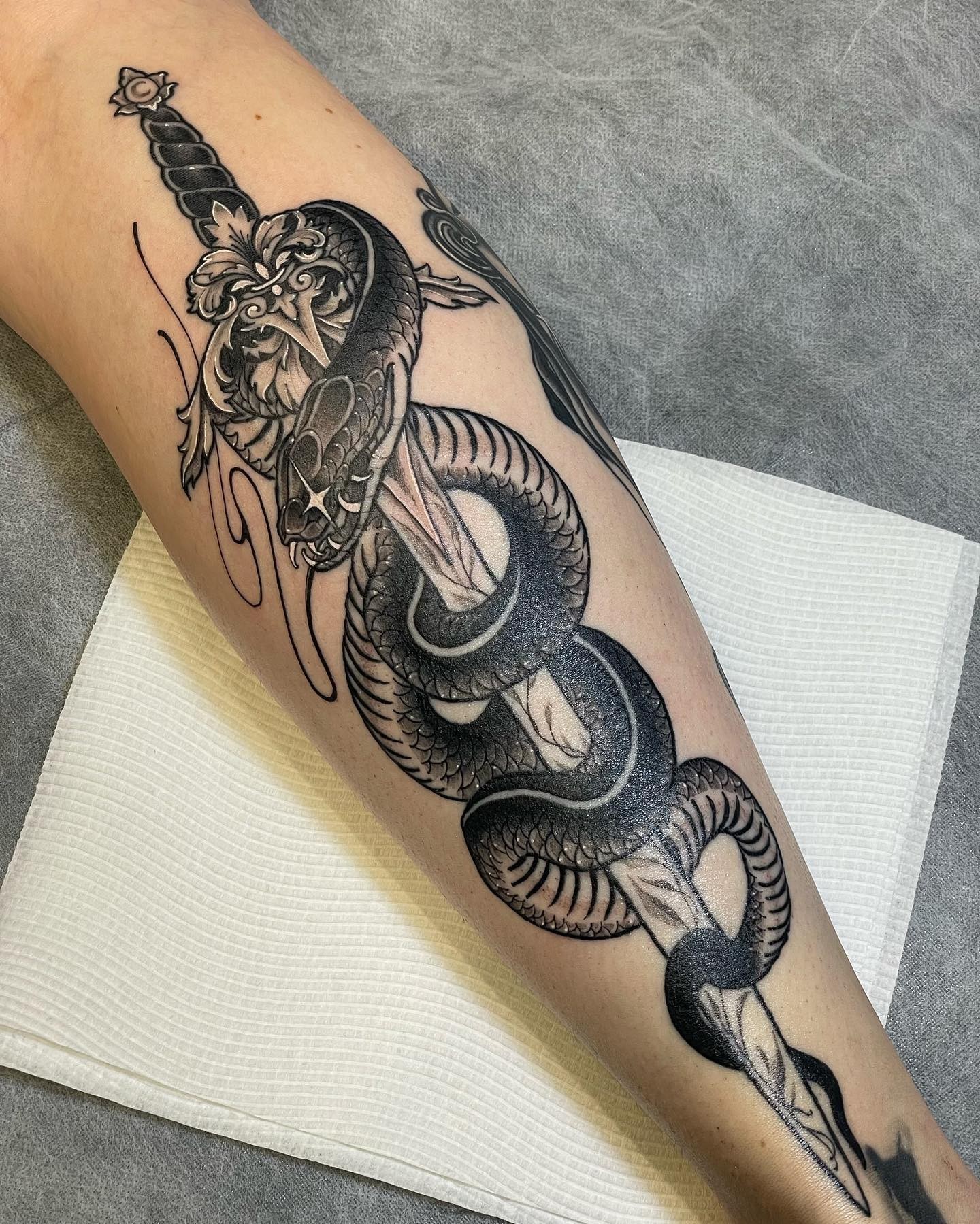 White And Black Grunge Sword Snake Tattoo