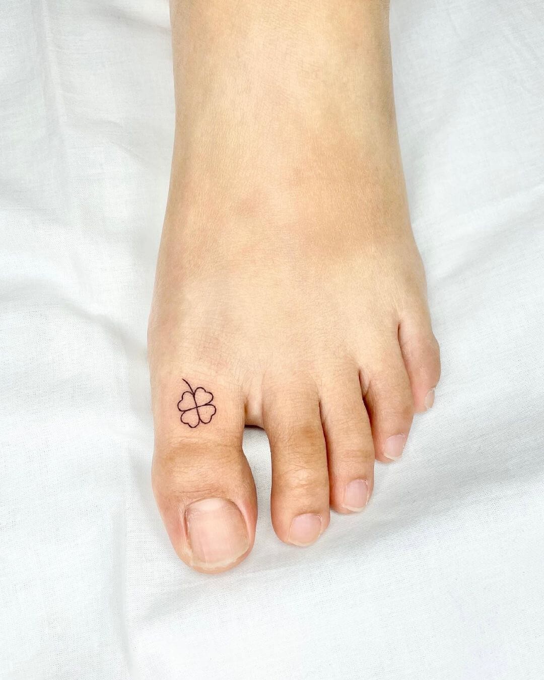 Minimalist Four Leaf Clover Tattoo