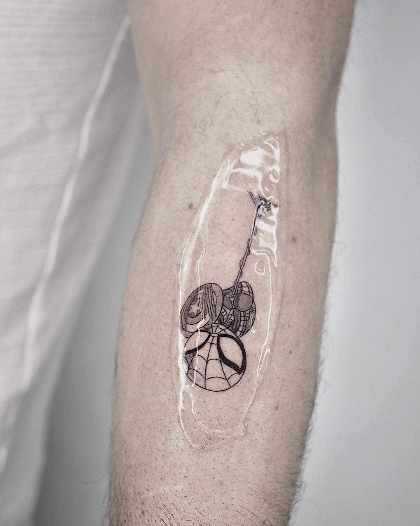 Cute Hanging Spiderman Tattoo