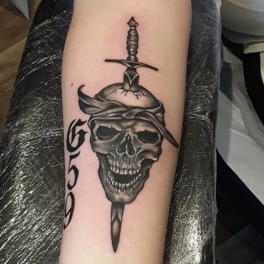 G59 Sword-Driven Skull Tattoos