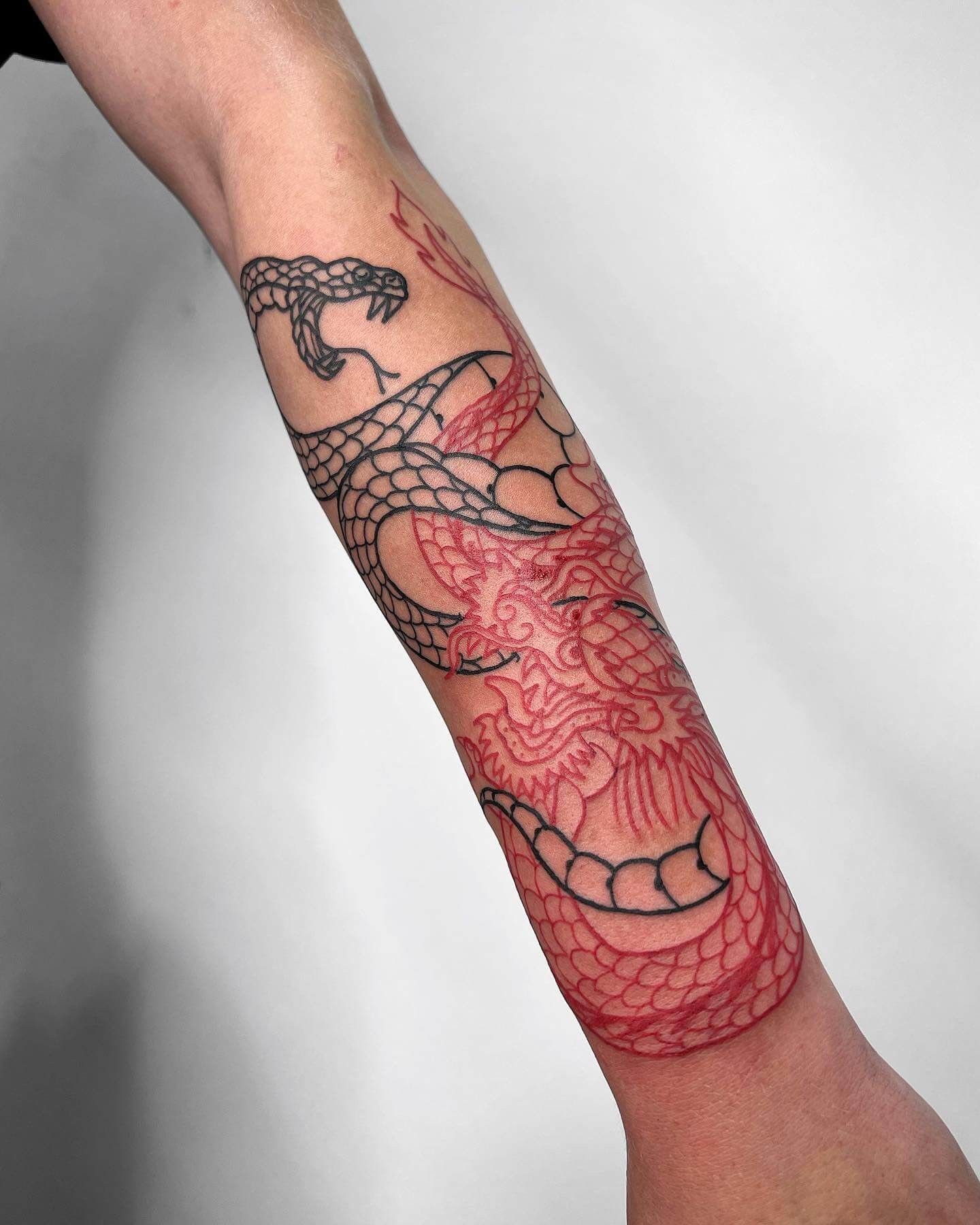 Duo-chrome Dragon And Snake Outline Tattoo