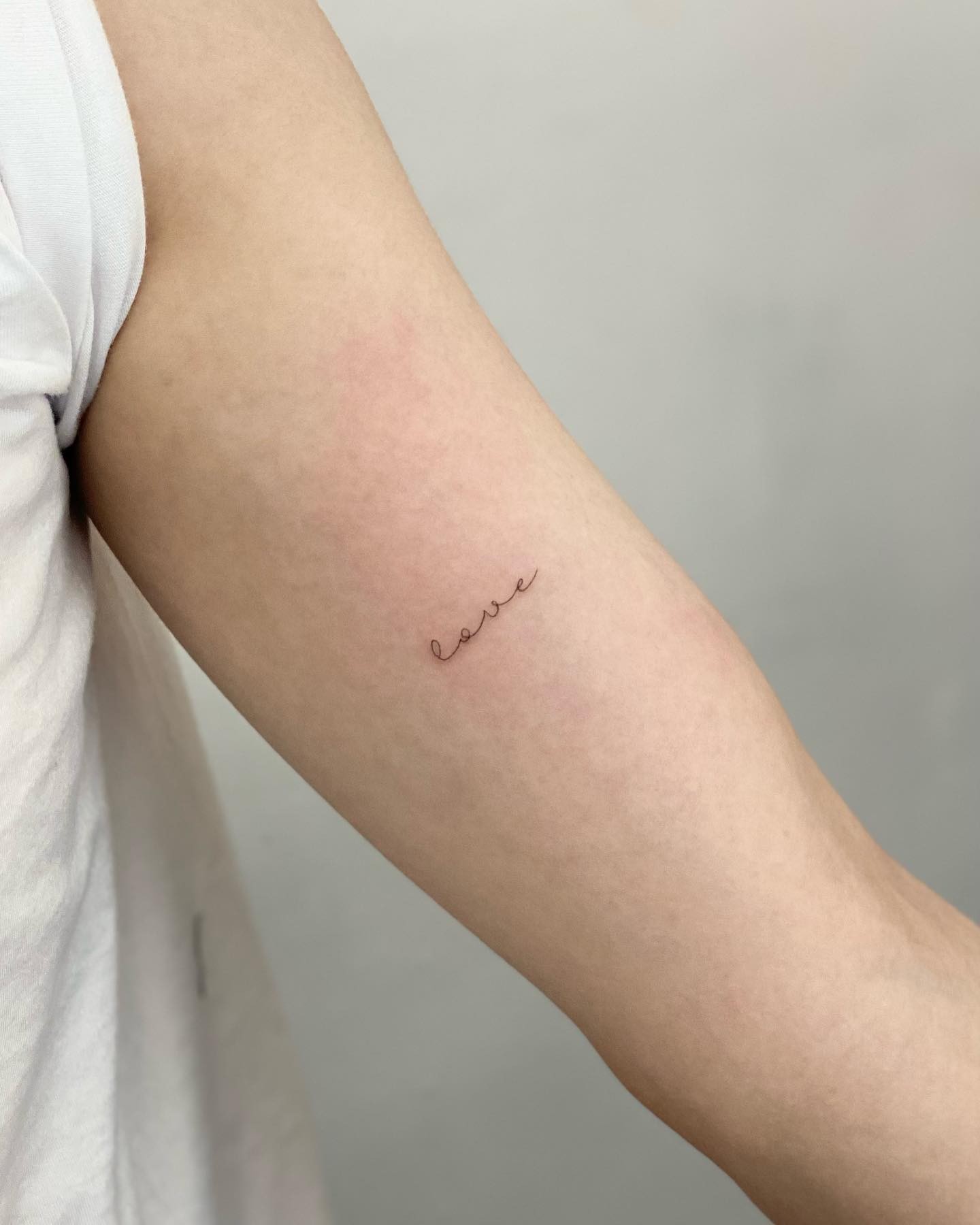 Single Word Script Font Tattoo