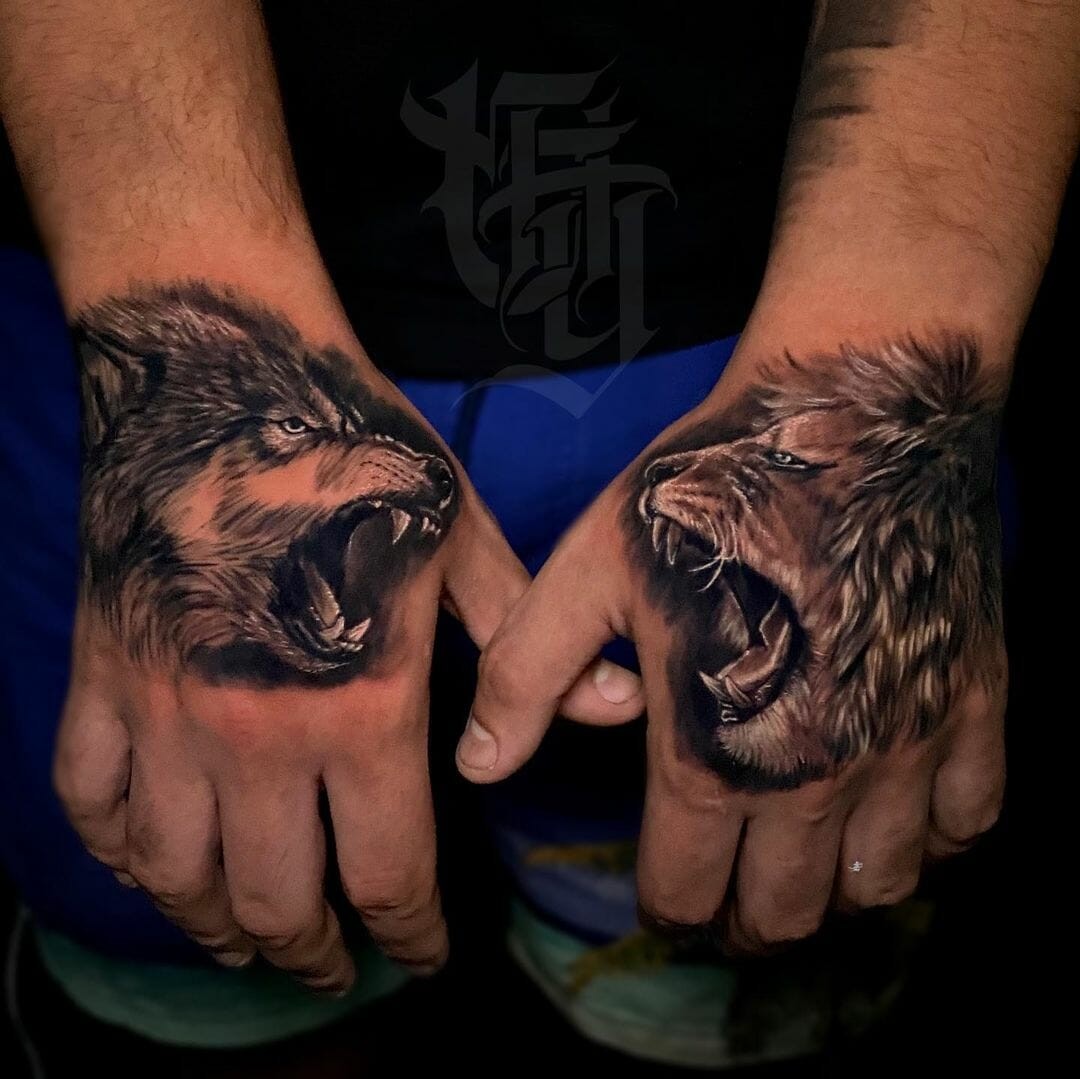 Wolf And Lion Hand Tattoo