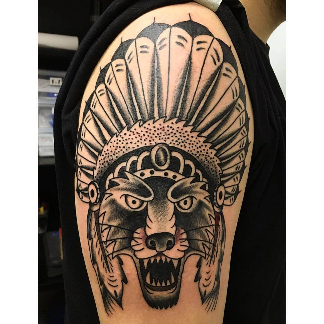 Aggressive Lone Wolf Tattoo With Headdress