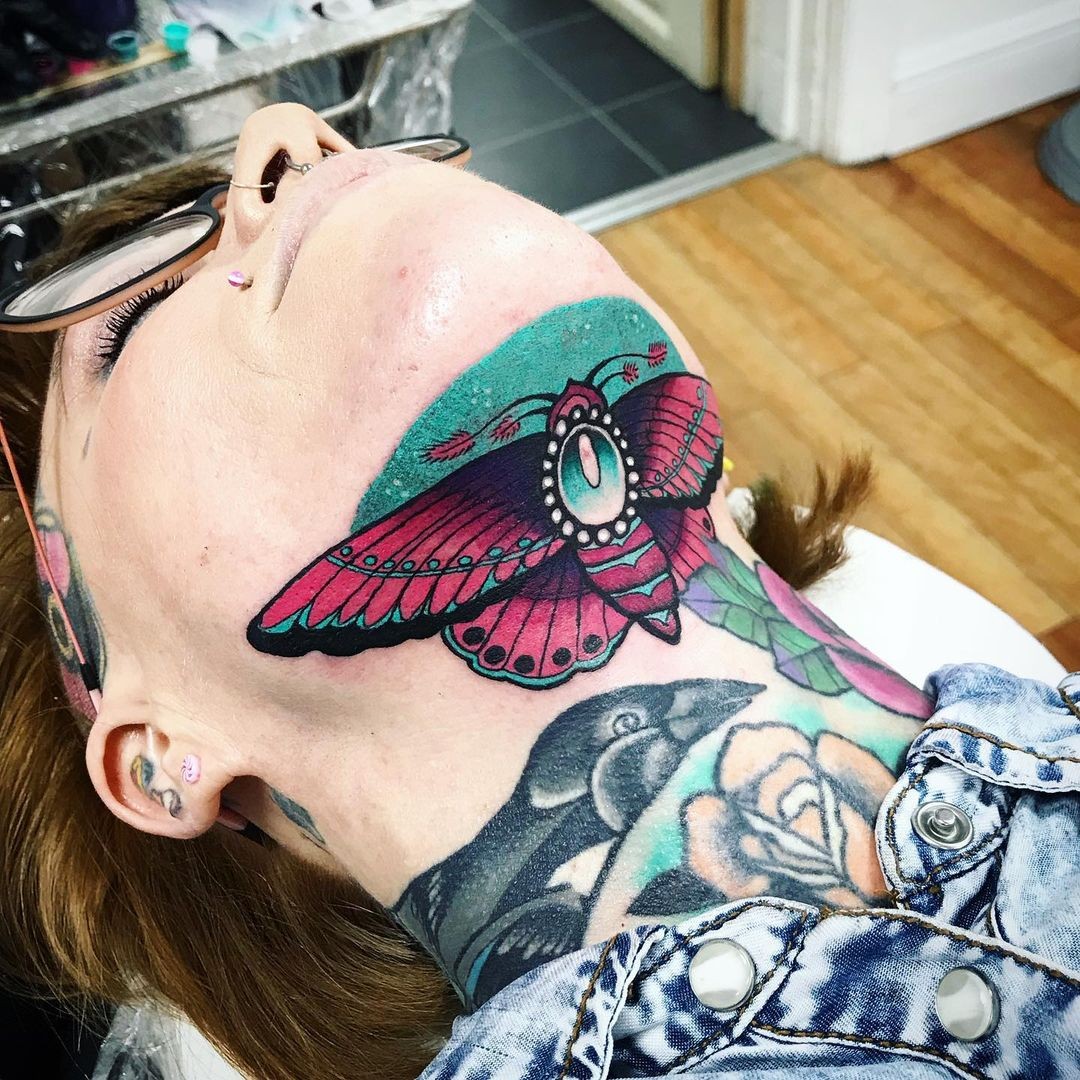 Insect Under Chin Tattoo