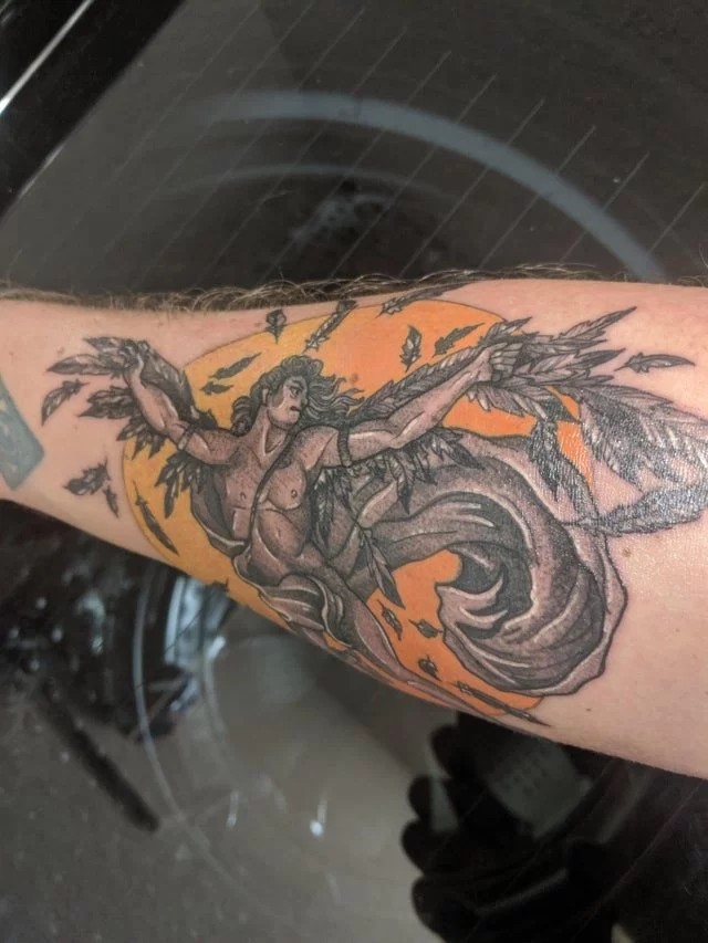 A Complex Graphic Icarus Tattoo