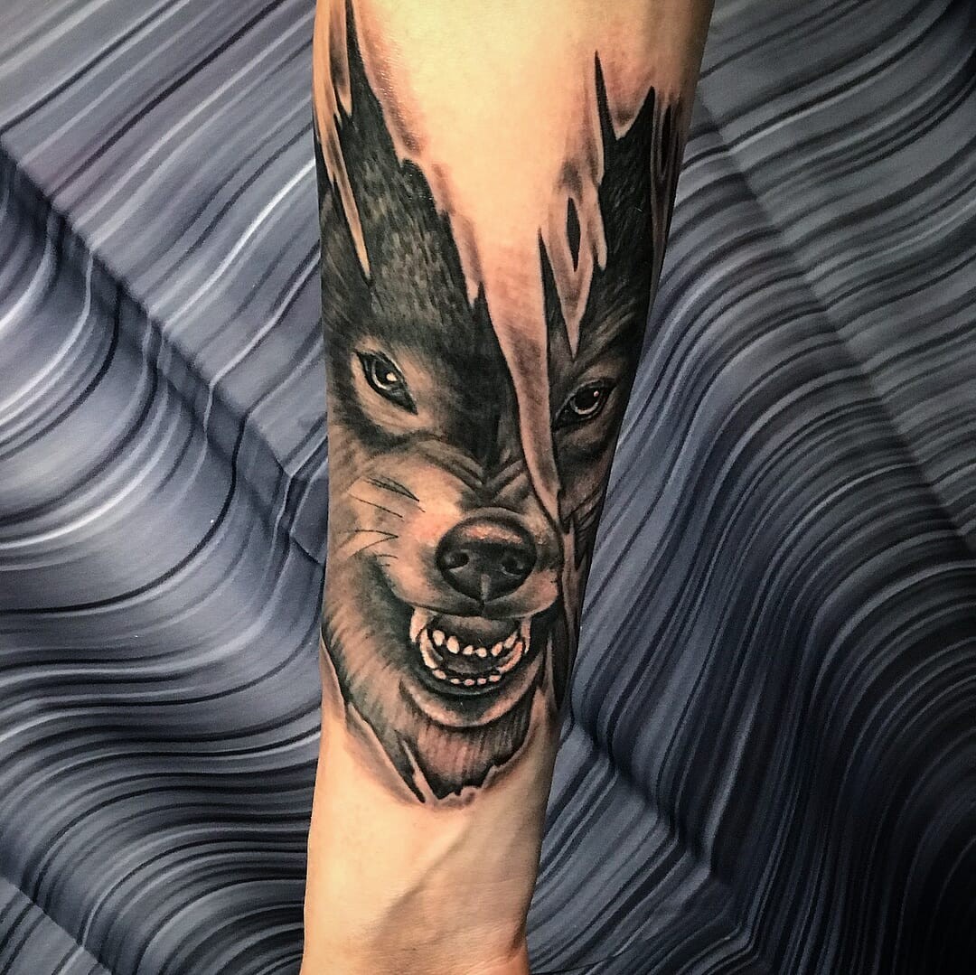 Ripped Skin Wolf Tattoo