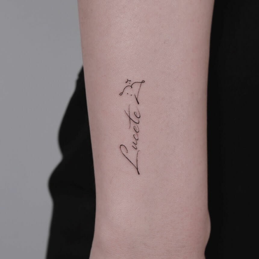 Bow And Sagittarius Arrow Tattoo Along With A Name