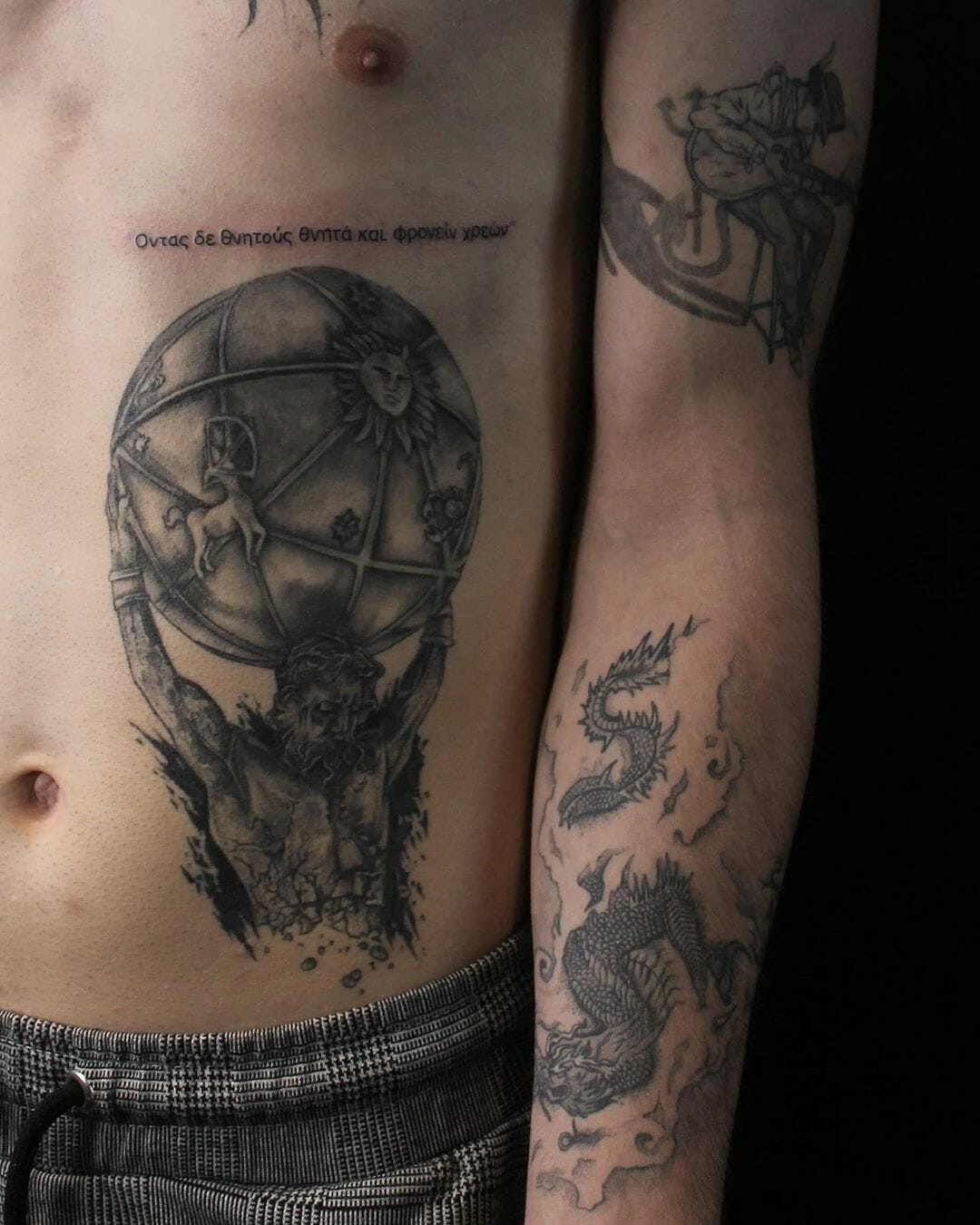 Quote in Greek and Traditional Atlas Design Tattoo