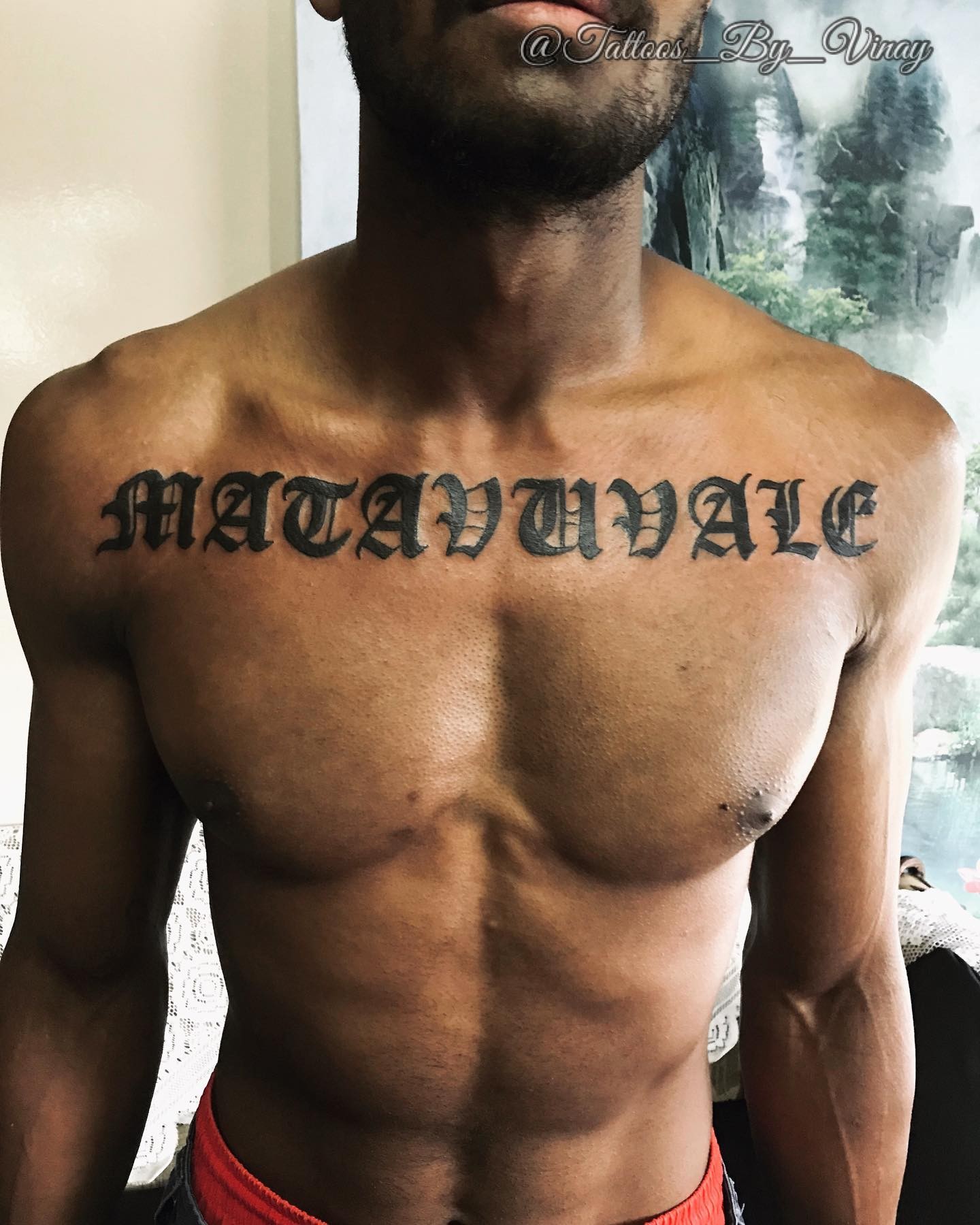 Old English Font Chest Lettering Tattoo For Men