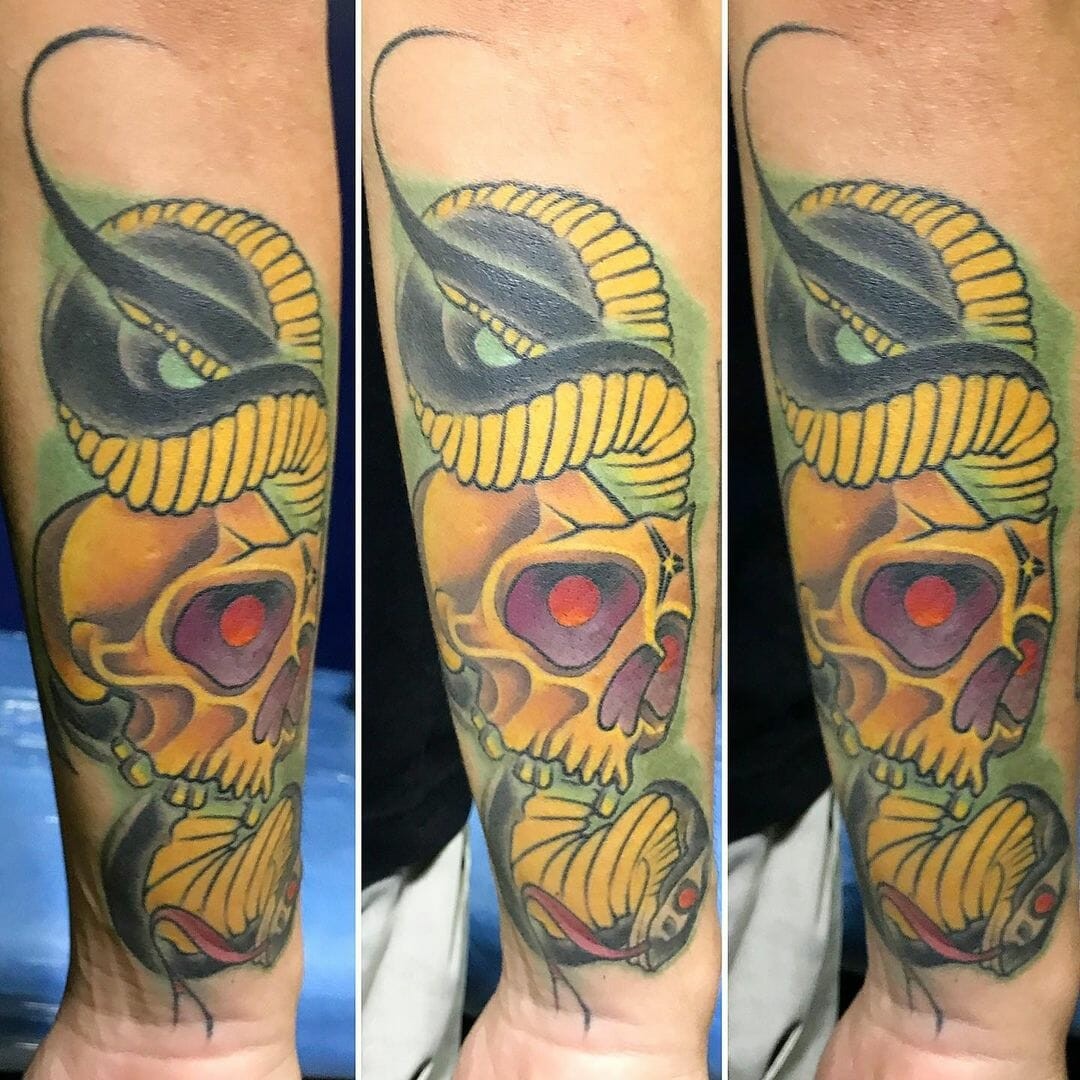 Black Mamba Around Skull Tattoo