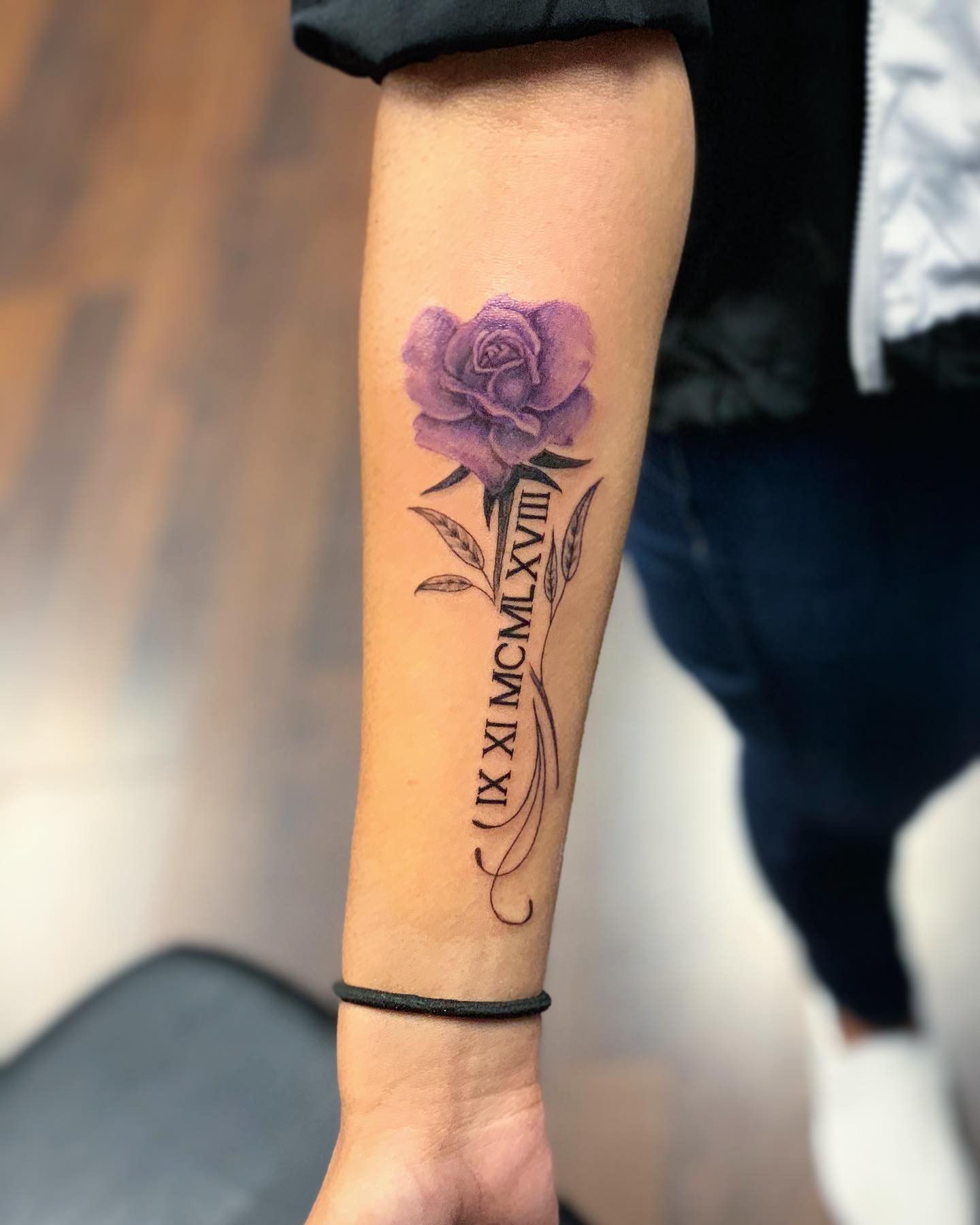 Violet Rose And Roman Numeral Tattoos On Wrist