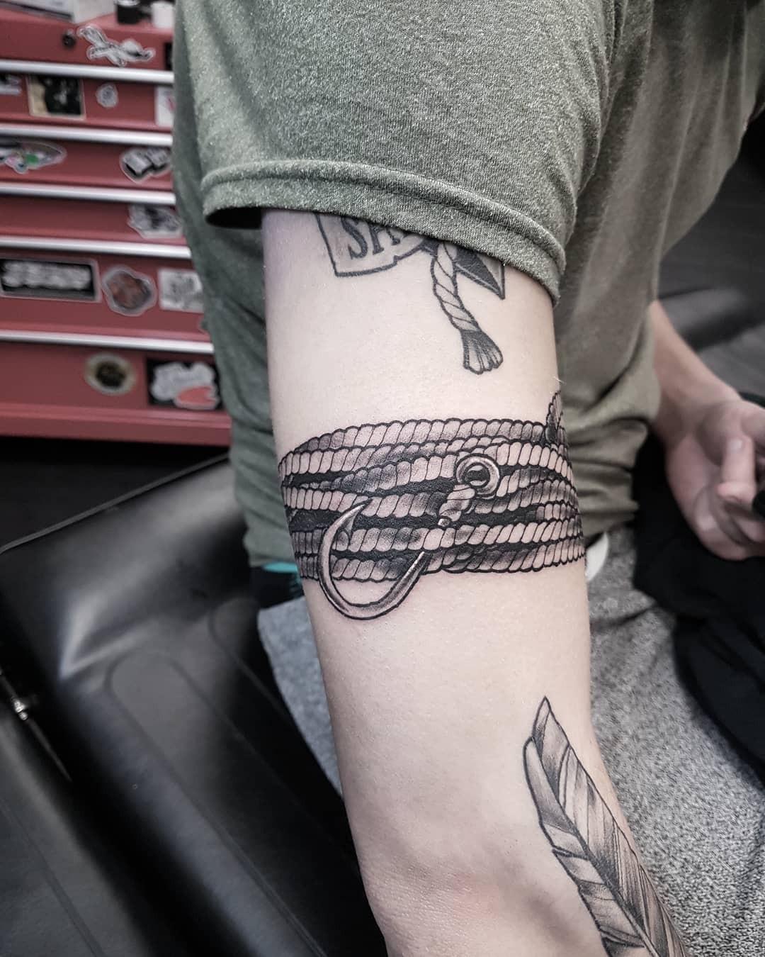 Wrap Around Fish Hook Tattoo