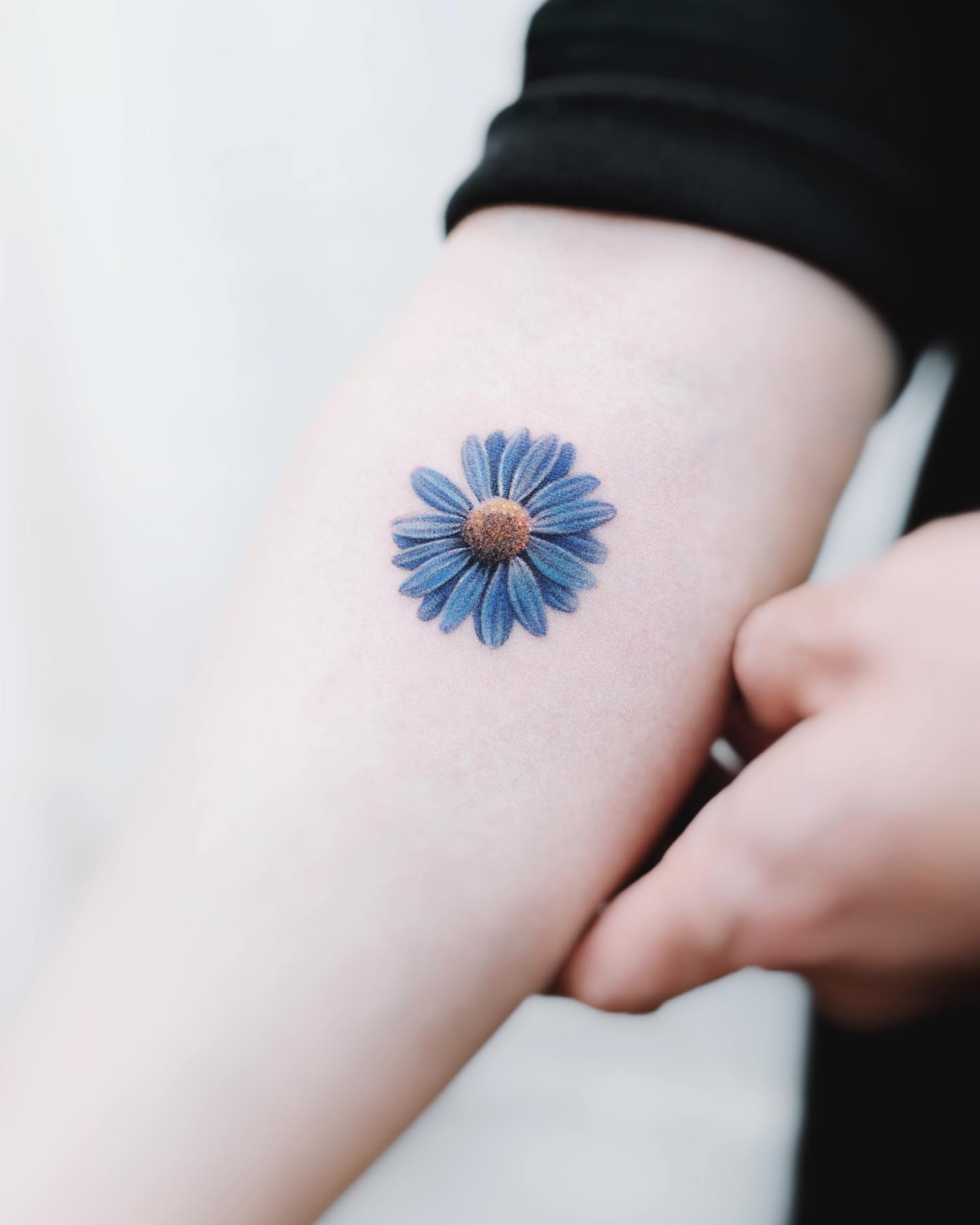 The Realistic Daisy Tattoo