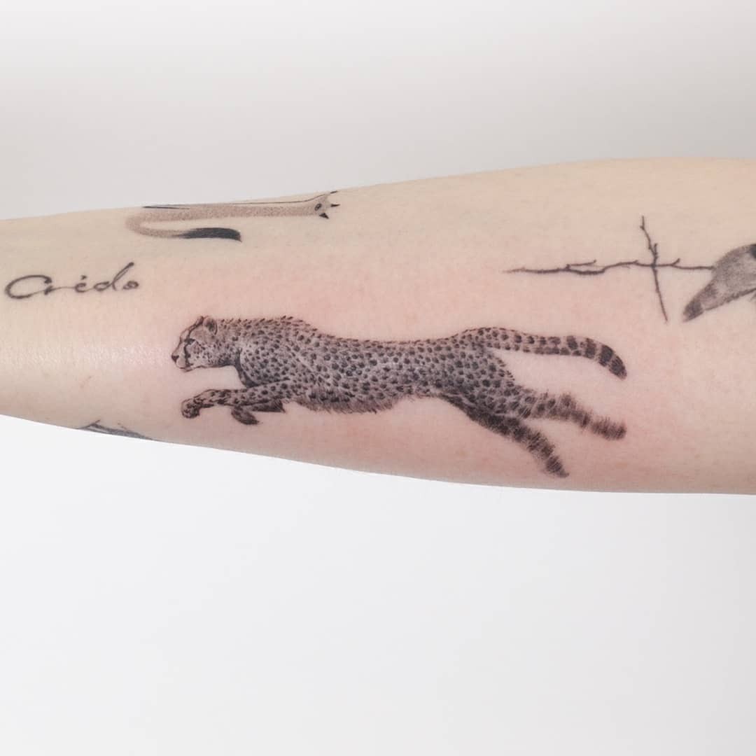 Forearm Running Cheetah Tattoo