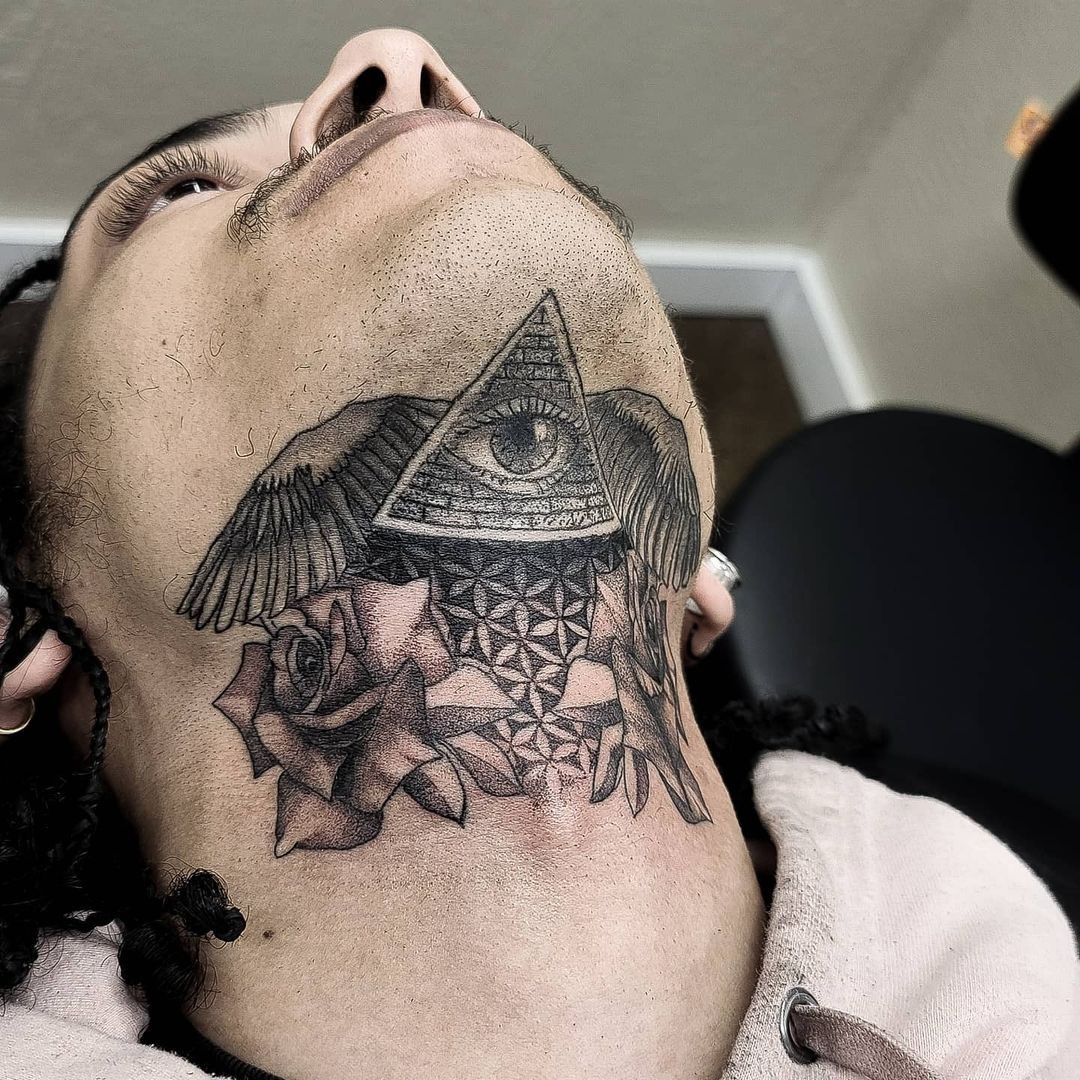 Elaborate Chin And Neck Tattoo