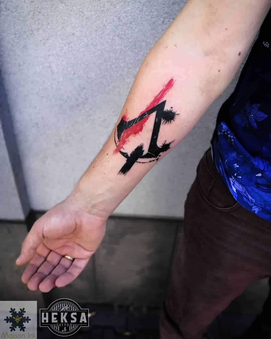 Assassins Creed Arm Tattoo