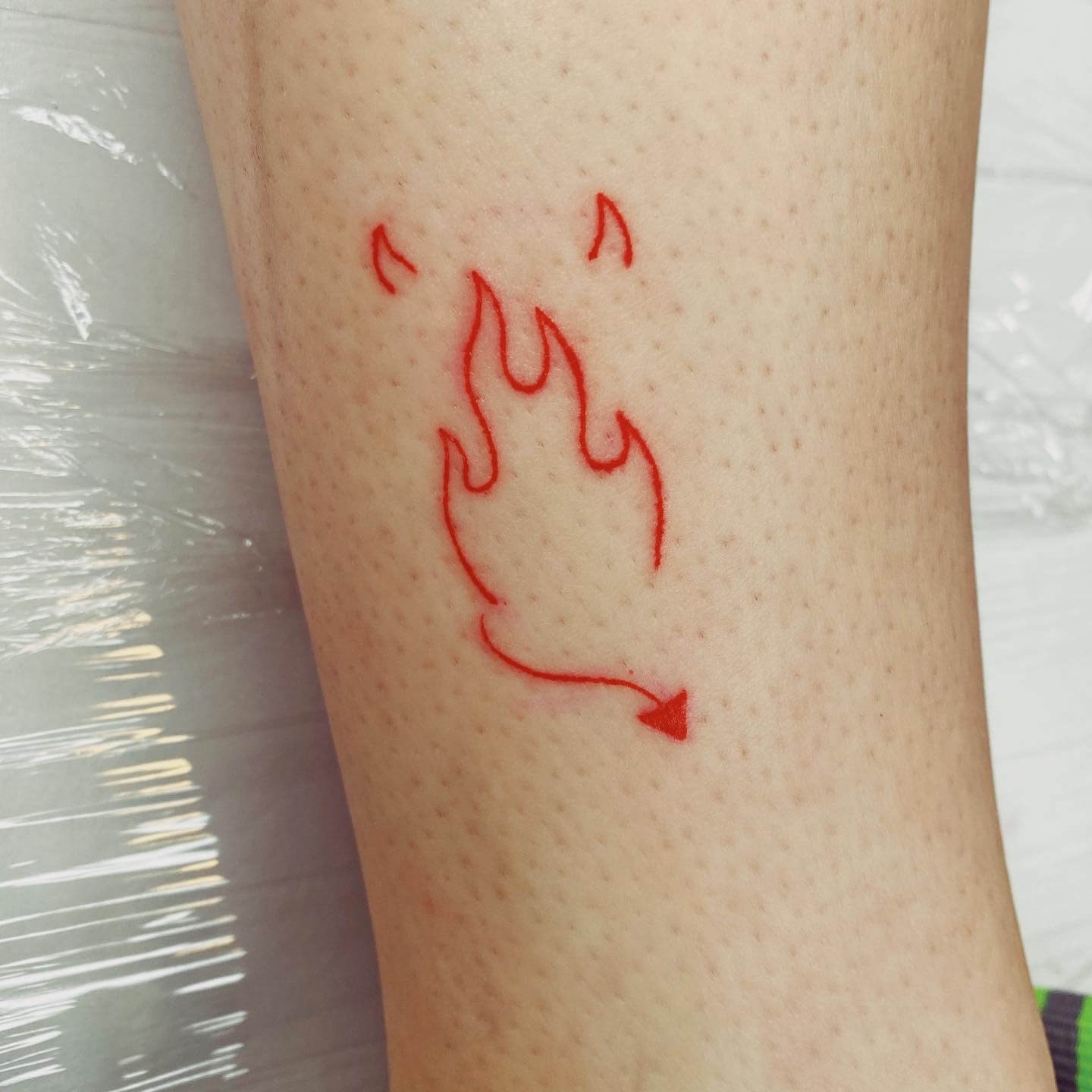 Red Flame Devil Horn Tattoo