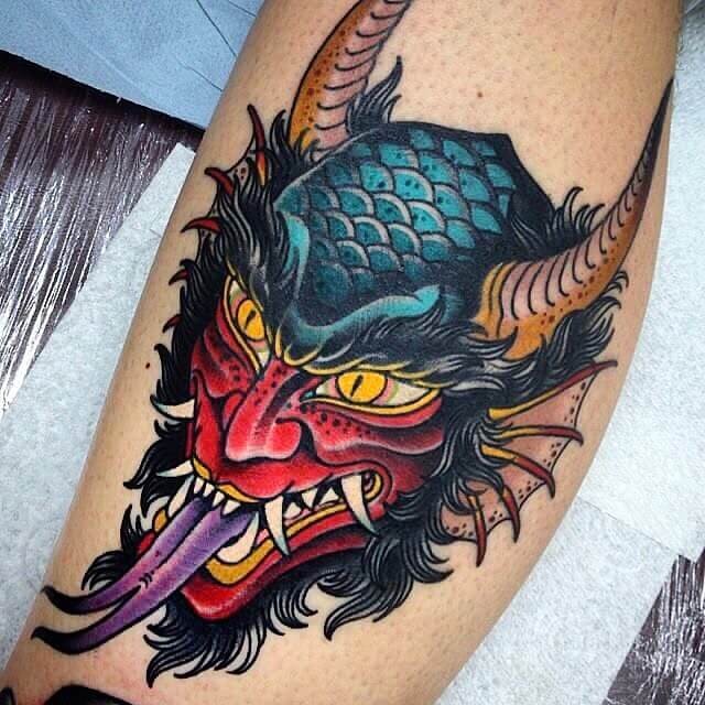 Evil Face Tattoo With Lots Of Vibrant Colours