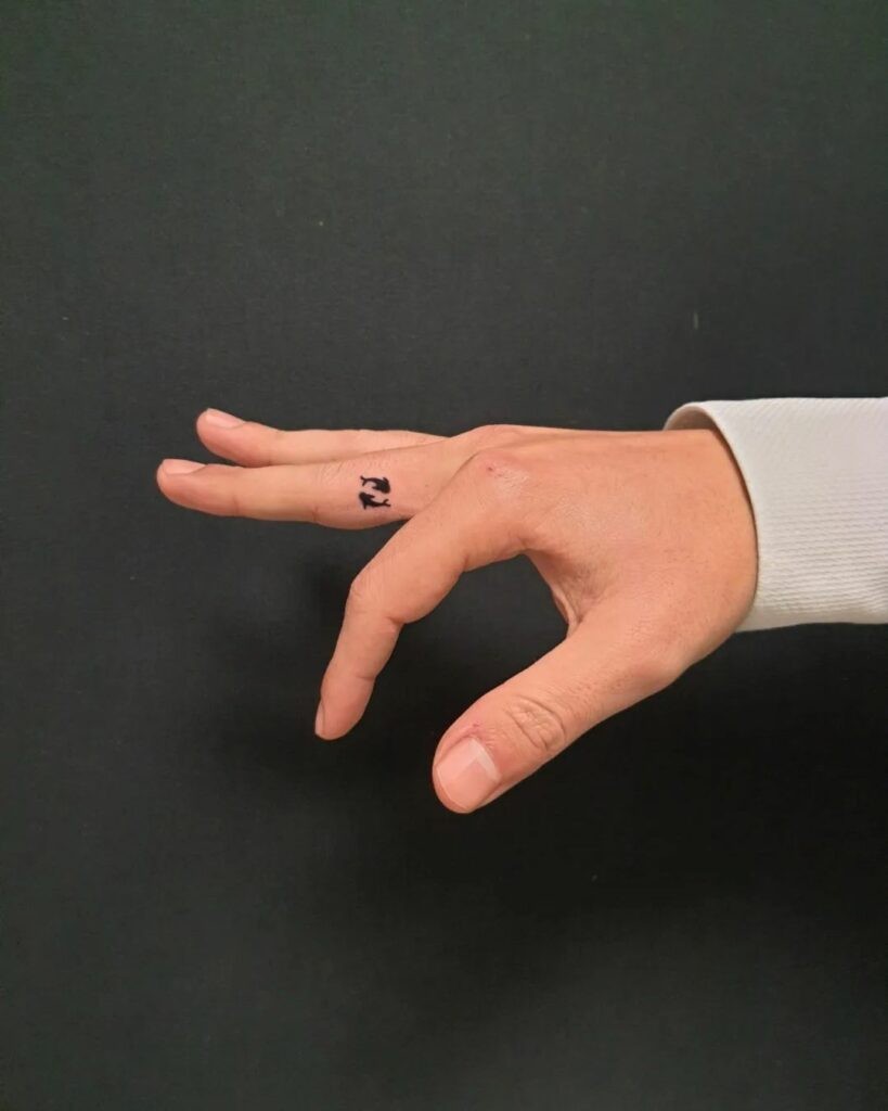 Minimalist Fish Inner Finger Tattoo Ideas