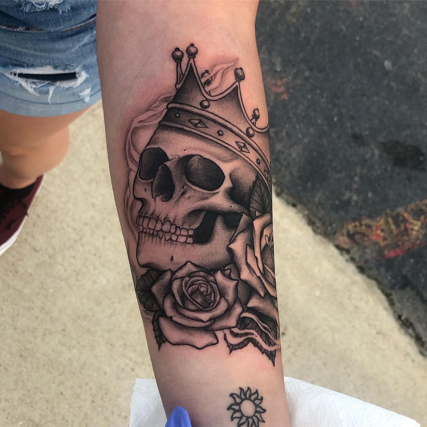 Hyper-realistic Skulls And Crown Tattoo With Roses