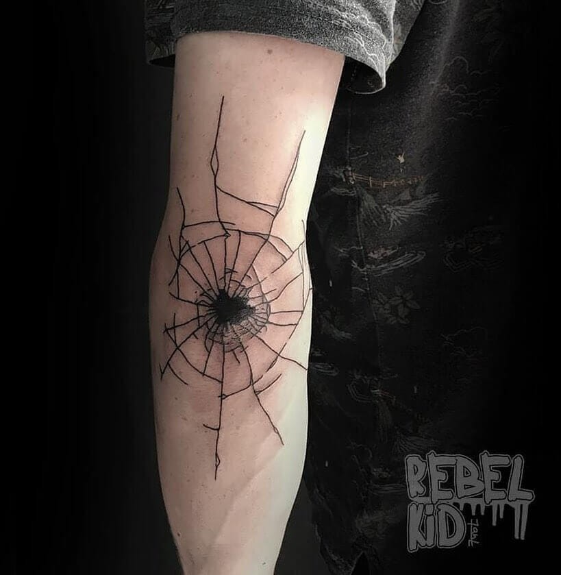 Bullet Hole Elbow Tattoo