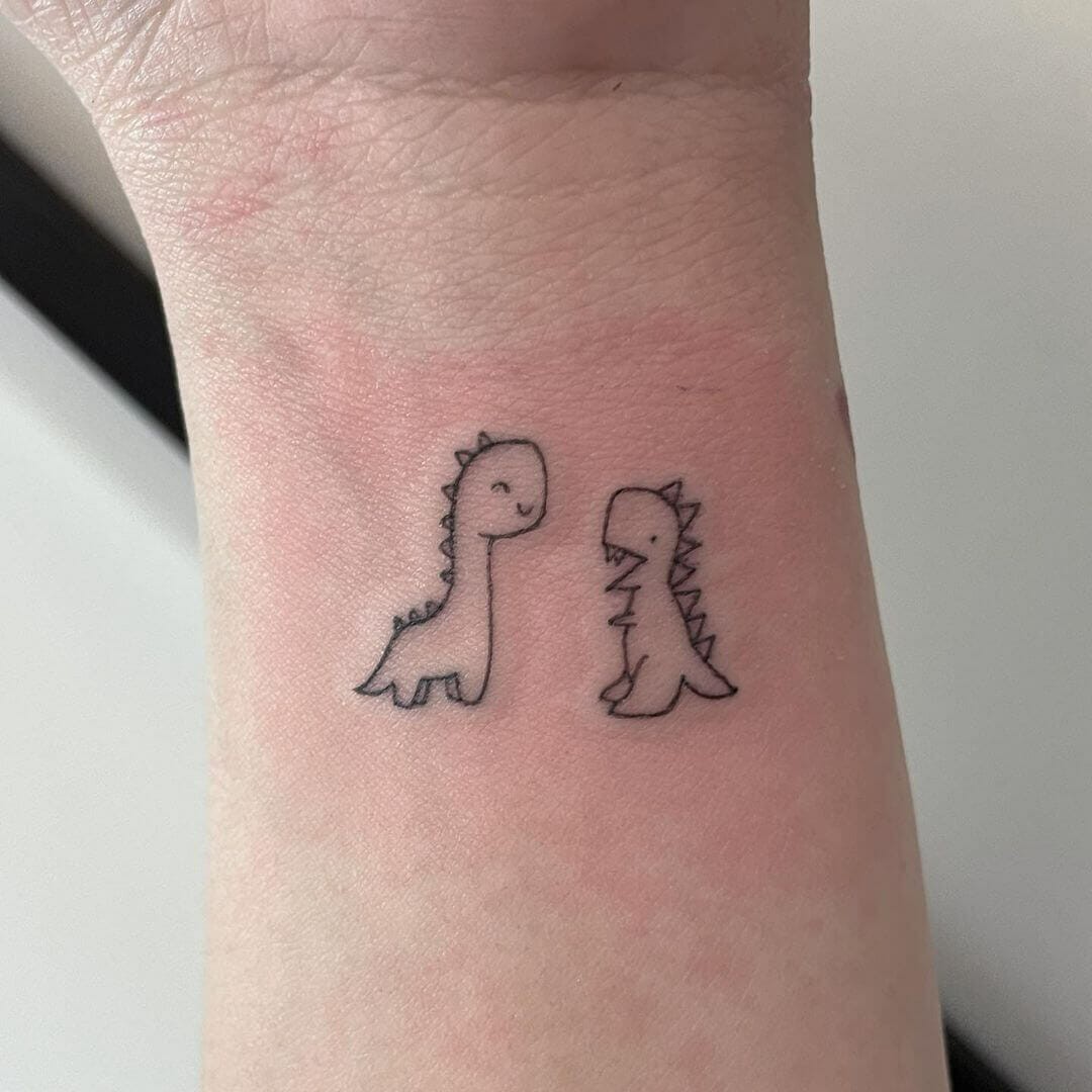 Tiny Adorable Dinosaurs Tattoo Design