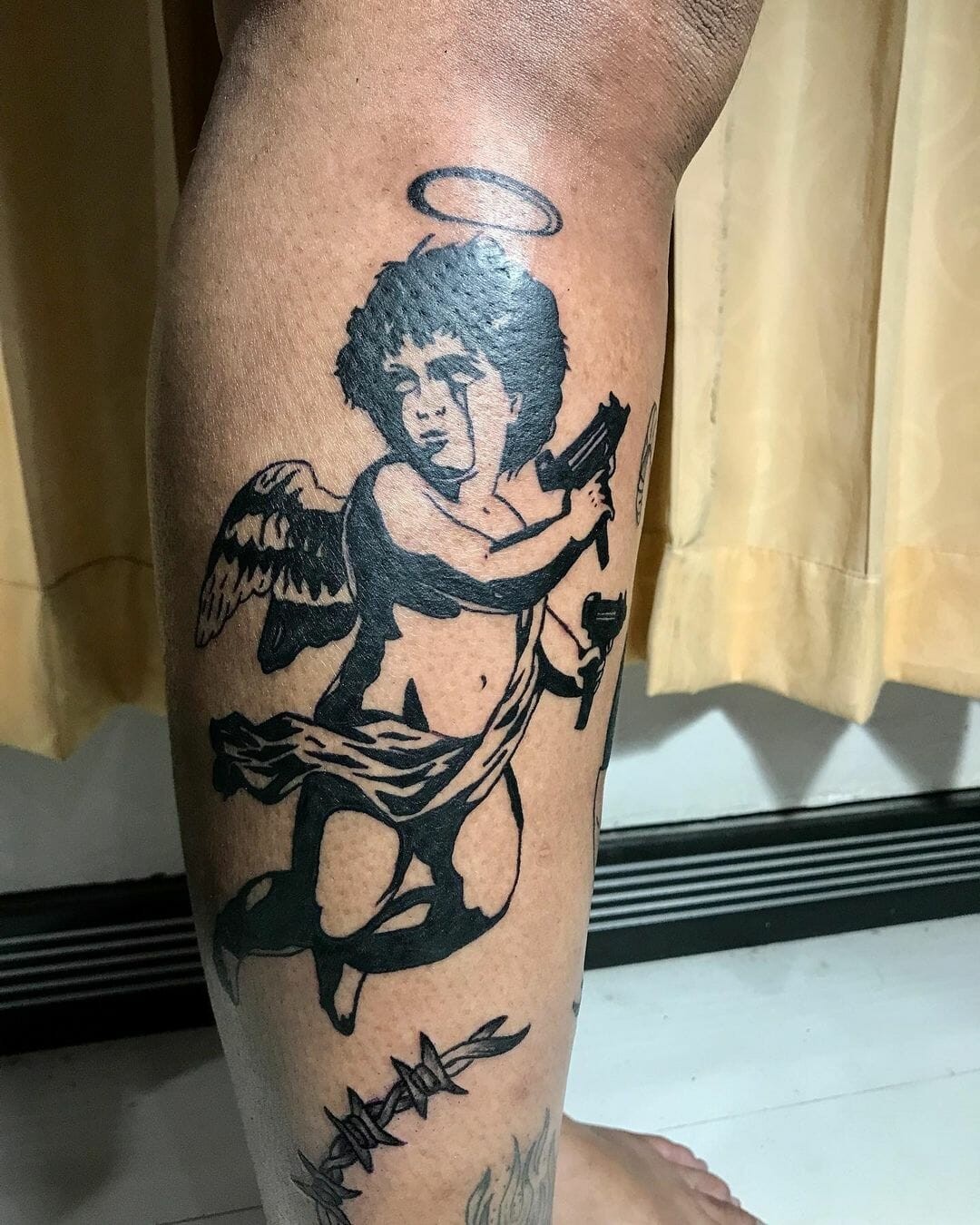 Cupid With An Uzi Tattoos