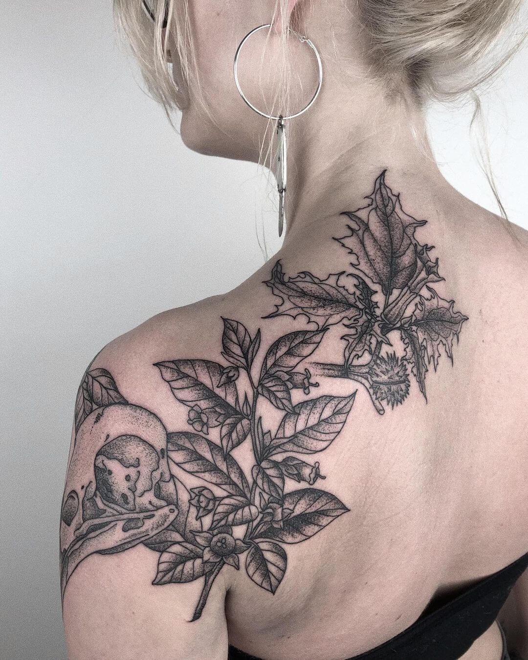 Belladonna Adorning Raven’s Skull Tattoo