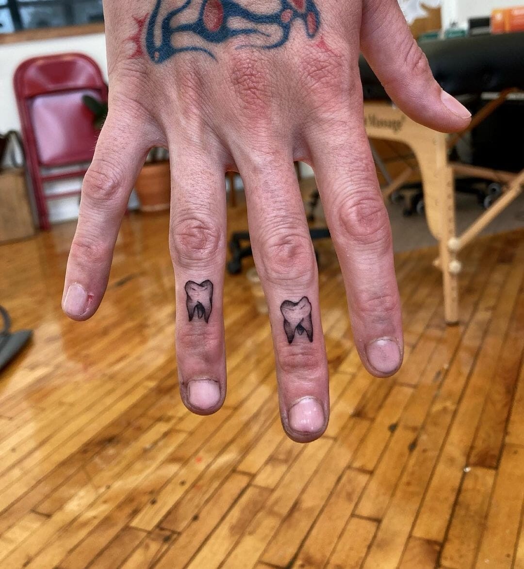 The Finger Teeth Tattoo