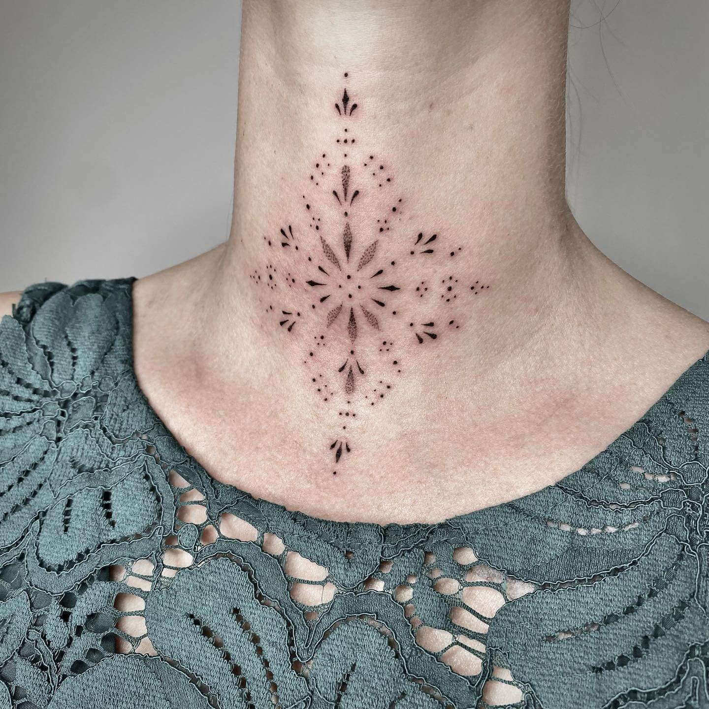 Ornamental Front Neck Tattoo