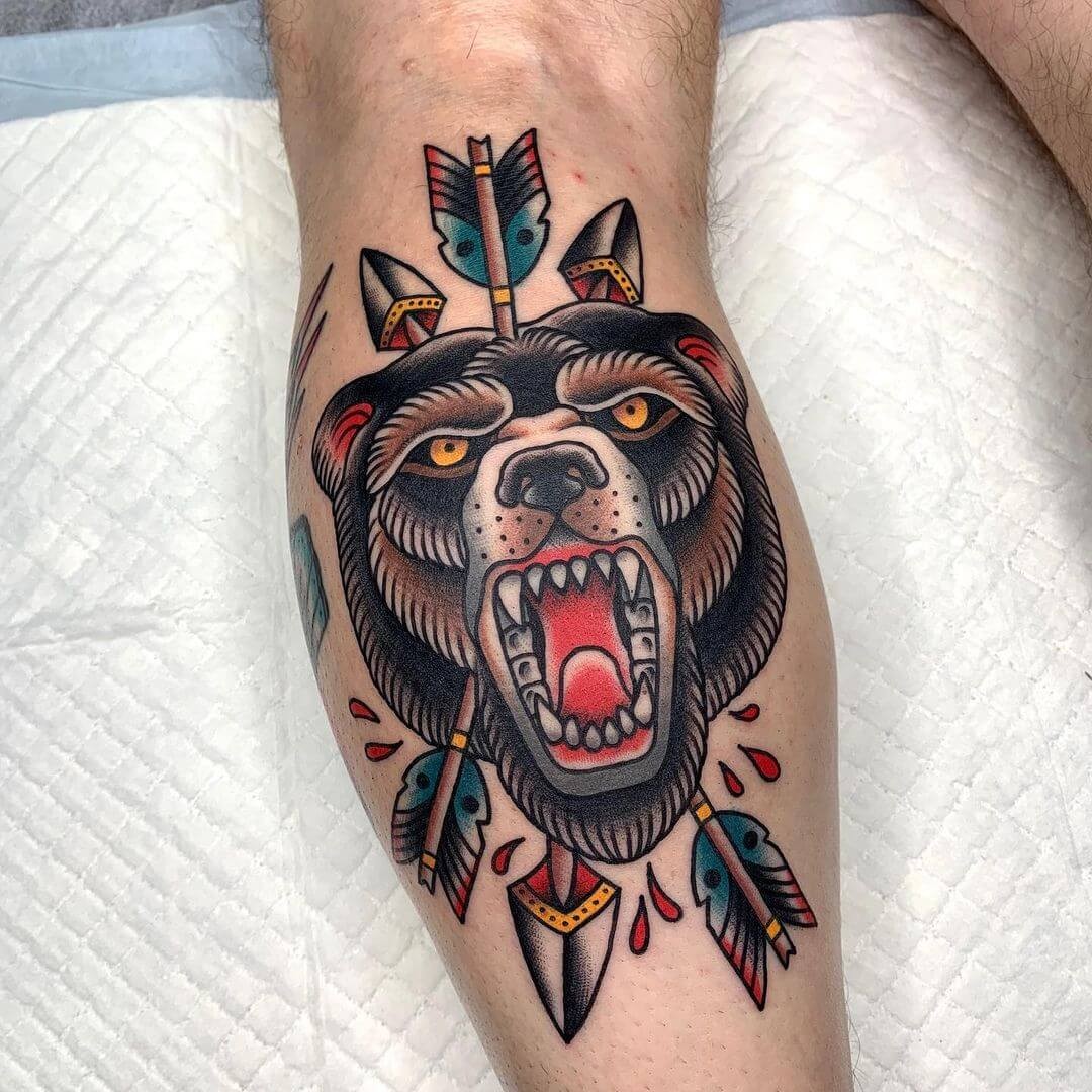 Bow And Arrow With Bear Head Tattoo