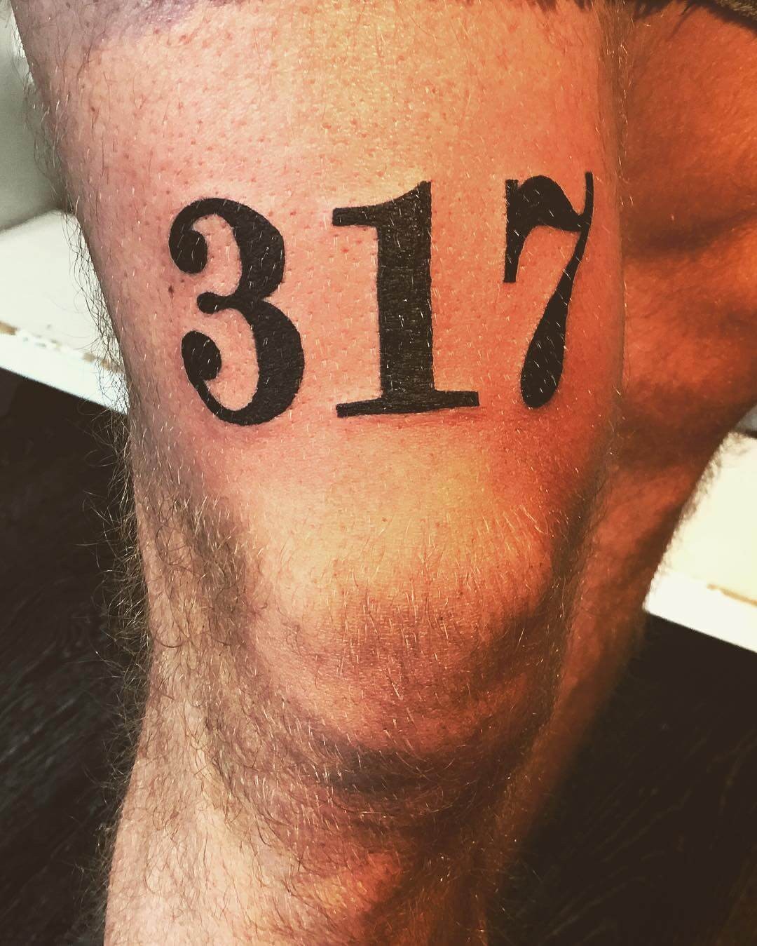 Area Code Tattoo Above Knee