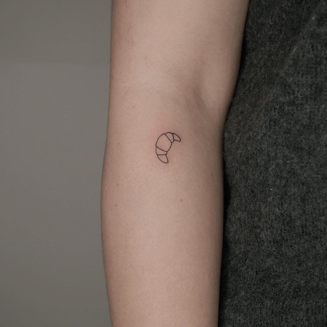 Minimalist Croissant Tattoo