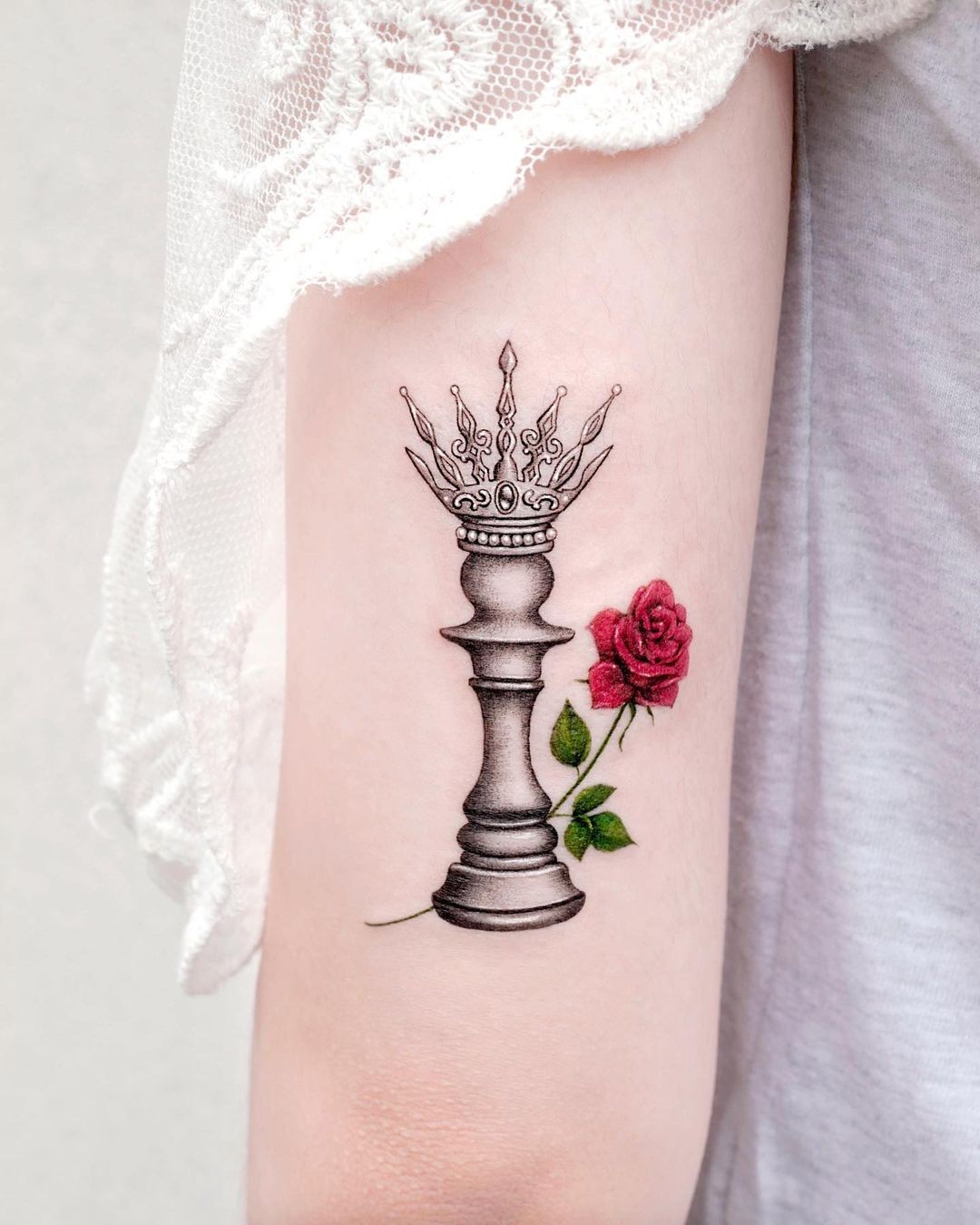 Enticing Queen Tattoo With A Rose